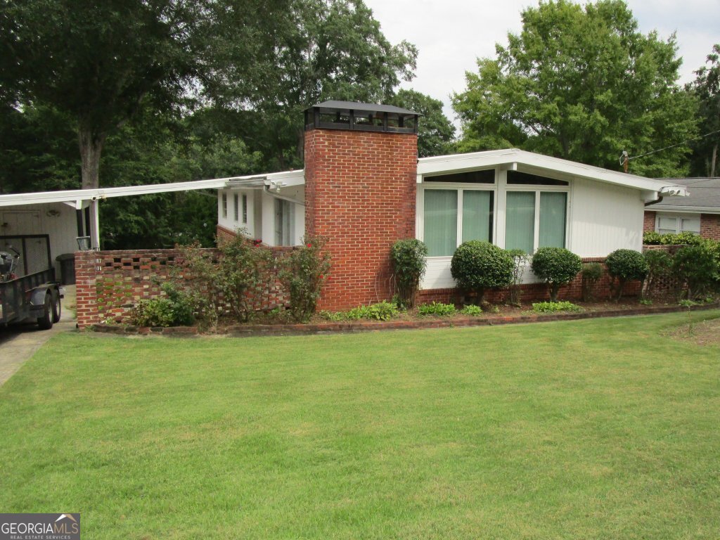 Bring your design vision to life in this mid-century modern gem. This home blends timeless character with a fantastic location, making car ownership almost unnecessary-schools, public transit, restaurants, and more are all within walking distance! Near Lennox & Phipps Mall. Built in 1955, this cherished single-family home sits on a 0.34-acre lot, featuring 3 bedrooms, 2 bathrooms, and plenty of living space. There is a fireplace in family room as well as a wood burning stove in basement area. The basement offers potential for additional living space. With a newer roof, water heater, and HVAC (all updated in 2023), the house has solid "bones" but could benefit from some updates. Owned by the same family since the 1970s, it carries a rich history. The spacious front and back yards are ready for you to create your private oasis. Thoughtful water runoff planning has kept the home, especially the basement, dry over the years. This well-maintained property is truly a treasure-come see it for yourself! A quick update for the area: The City of Brookhaven has begun work on their Multi-Use Path which will provide walking and potentially bike access to surrounding parks, walking trails, and restaurants. "The City of Brookhaven carried out a study on North Druid Hills Road between SR 141/Peachtree Road and SR 42/Briarcliff Road. The goal was to create a vision for the corridor to accommodate future traffic and enhance facilities for pedestrians, cyclists, and transit users." Please request more info. **Virtual staging photos are used to showcase how spaces might potentially look.