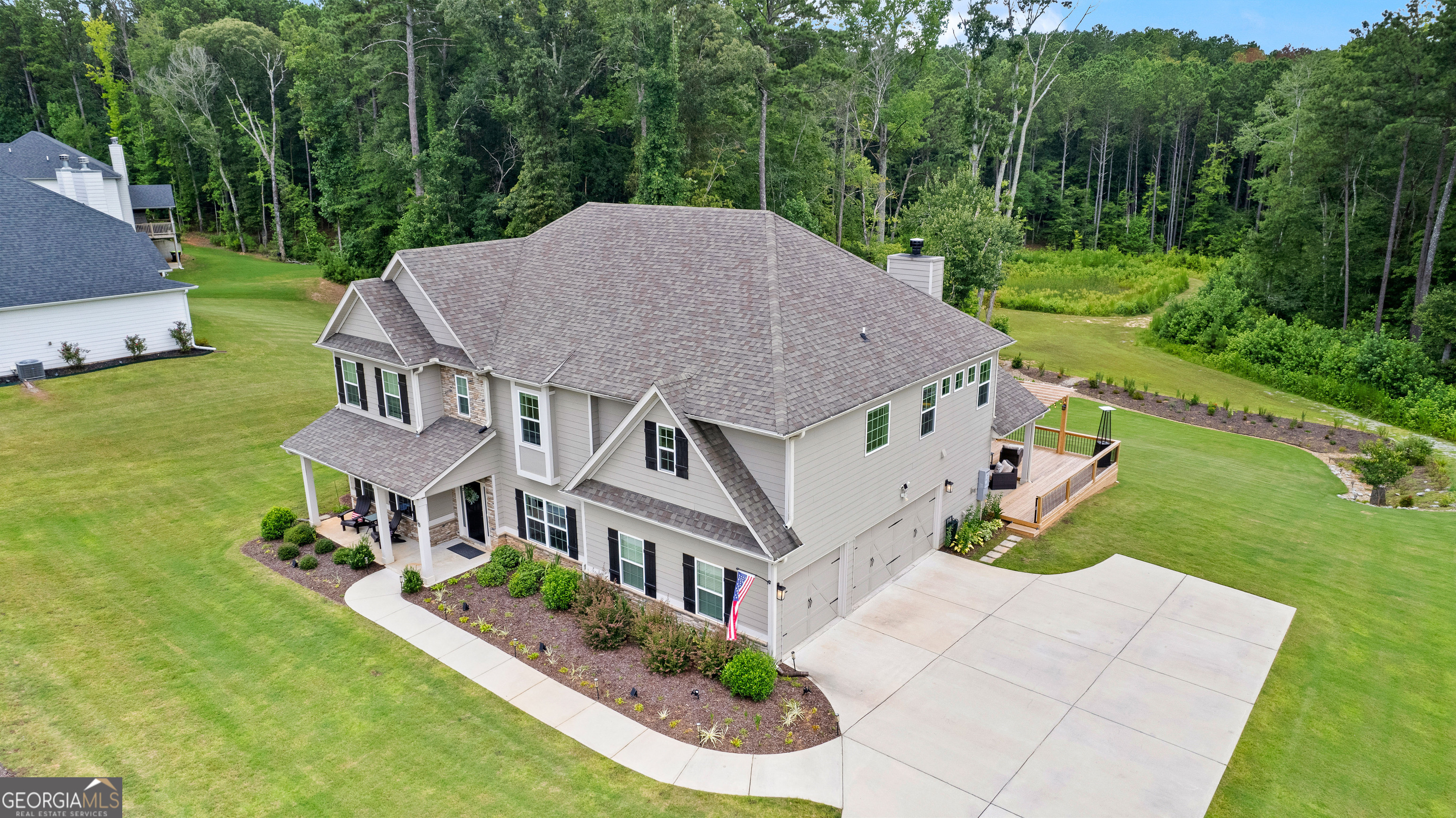 Experience elevated living in this exceptional 5-bedroom, 4.5-bath home, gracefully situated on a full acre, just minutes from the lifestyle and charm of Serenbe; and less than 20 minutes from downtown Atlanta! Boasting one of the largest and most thoughtfully designed floorplans in the neighborhood, this home seamlessly blends elegance, comfort, and functionality in one of the community's most peaceful and private enclaves. At its heart is a sprawling, west-facing deck - an entertainer's dream - designed for unforgettable evenings under the stars and breathtaking sunset views. Whether you're hosting an intimate dinner party or a lively gathering, this stunning outdoor space offers a serene backdrop for every occasion. Inside, spacious living areas flow effortlessly, including a dedicated media room perfect for movie nights or game-day viewing. For music lovers, take note that one of the bedrooms was used as music room-ideal for practicing, recording, or simply enjoying the art of sound in your own sanctuary. The owners have enhanced the natural beauty of the property by pushing back the tree line and creating a private walking path - your own peaceful retreat tucked just beyond the home. With refined details, flexible living spaces, and unmatched outdoor ambiance, this property offers a rare opportunity to live, entertain, and create in serenity. And as a bonus the 4 mounted televisions, refrigerator, washer and dryer all stay with the home. This home is more than a place to live - it's a place to enjoy life to the fullest and is truly move-in ready!