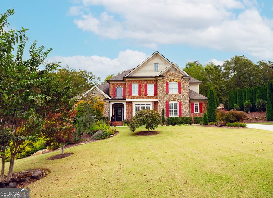 Don't miss out on this new listing in sought-after neighborhood in Forsyth County! This custom-built home has so much to offer and incredible curb appeal. As you walk into the 2-story foyer, you have a formal dining room to the right, ahead of you an inviting formal living room with high coffer ceilings, large windows with natural light overlooking the stunning .72 acre lot that has been meticulously maintained. The oversized owner's suite located on the main level, with tray ceilings, double vanities, separate tub and shower, and great walk-in closet. The chef-style kitchen has an oversized island, gas cooking, and tons of storage with a great pantry, overlooking the keeping room with beam ceilings, custom built-ins, rock fireplace, separate breakfast area and a large screen in porch to relax. Off of the kitchen you will find laundry room and mud room that opens to a three-car garage. On the second level you will find 3 nice size additional bedrooms and 2 full baths. A loft that can be used for an office, media room or an additional bedroom. The unfinished basement is waiting for someone's personal touch with exterior entrance. This home is great for entertaining. Cool Springs Subdivision are high level homes with a Community Pool and Two Tennis Courts. Only 5 minutes from GA 400, Hwy 369, and new retail developments. Excellent Award-Winning Forsyth County Schools!