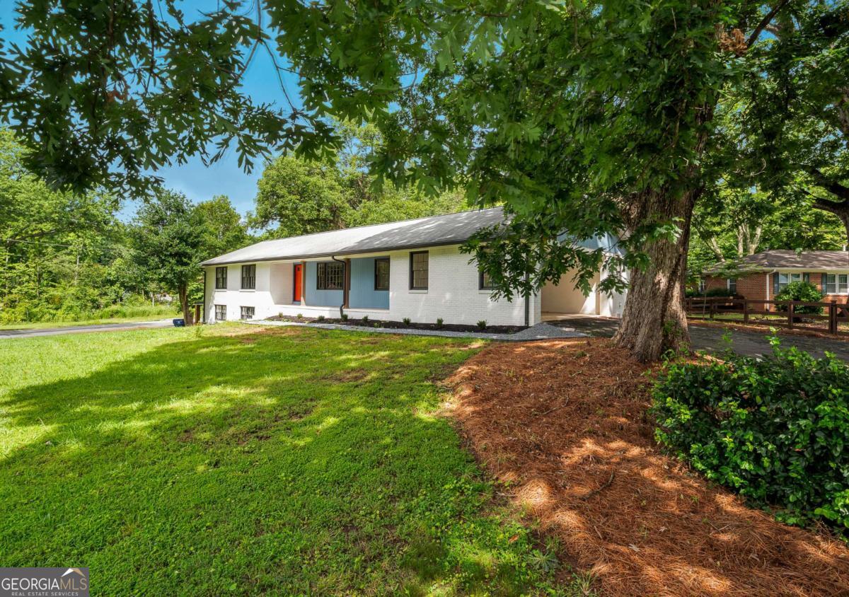 Available Now! Renovated East Cobb 3BR / 2BA home located in the Pope HS District. Features are BRAND NEW EAT-IN KITCHEN WITH BREAKFAST BAR; FORMAL DINING ROOM; FAMILY ROOM WITH FIREPLACE; FORMAL LIVING ROOM; SPACIOUS BEDROOMS WITH DOUBLE CLOSETS; FRESH PAINT INTERIOR/EXTERIOR; BRAND NEW LVT THROUGHOUT; NEW APPLIANCES; SUNROOM THAT OVERLOOKS LEVEL FENCED BACKYARD; AND DOUBLE CARPORT. Walking Distance to East Cobb Swim/Tennis and easy access to Freeway and lots of shopping and Restaurants!! Top-notch schools (Pope High, Dodgen Middle, Murdock Elementary). Landlord will take care of yard maintenance. Tenant is required to get Renters Insurance and show proof of policy. Qualification requirements are as follows: - 640 credit score - Proof of combined household income of 3x monthly rent - 45% Debt to income ratio - Clean background check -Security deposit and first month's rent due at signing. Applicants may apply through RentSpree.