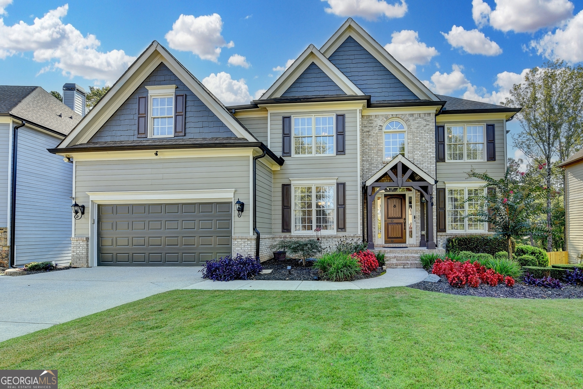 Welcome to this exceptional Home in the sought after swiim/tennis community of Daniel Park in Dacula. We are offering this 5 Bedroom / 5 Bath home on a full finished basement providing over 5,000 Sq Ft of beautifully designed living space* The main floor kitchen is outfitted with custom cabinetry, luxurious custom built stone-topped island, with second sink and disposal, microwave and plenty of storage*double ovens, pot filler*Coffee station at butlers pantry*A keeping room right off the kitchen adds even more flexibility and charm to the home's layout*Refinished hardwood floors on main*2-story Family-room has custom built cabinets that flank the fire-place* Coffered ceiling in formal dining-room*In-law suite on main level*Formal living room with double doors is designed to entertain your guests or you can curl-up to read a book, can't wait for you to see it* Upstairs has 4 bedrooms*New carpet in bedrooms* two with en-suites and one jack-n-jill to share. Upstairs the Primary suite is a true retreat, larger than most, it has a dedicated sitting area perfect for unwinding*The updated en-suite boasts a frameless glass shower, modern finishes, and a spa-like ambience*An Elevated terrace-level offers the perfect blend of entertainment and versatility featuring a spacious game room, a custom designed bar ideal for hosting and relaxing in style, a full size kitchen will meet your needs for extended stay or making snacks while you enjoy movie night. A dedicated office to work from home or a guest suite with full bath, ample storage. Step outside where meticulously maintained grounds provide a serene and elegant backdrop for outdoor living* Located in the top-rated Mill Creek High School district, this home delivers the perfect mix of modern comforts and timeless design, creating a lifestyle where elegance meets longevity. Pictures coming soon!