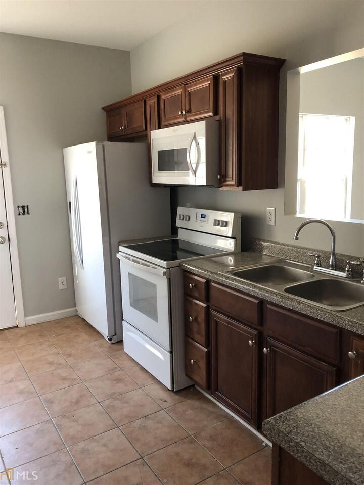 This Loganville property offers a 1-car garage, a third level for an awesome office/4th bedroom. Second level accommodates Master Bedroom with sitting area, walk in closet and private master bath. Two spacious secondary bedrooms share second full bathroom.