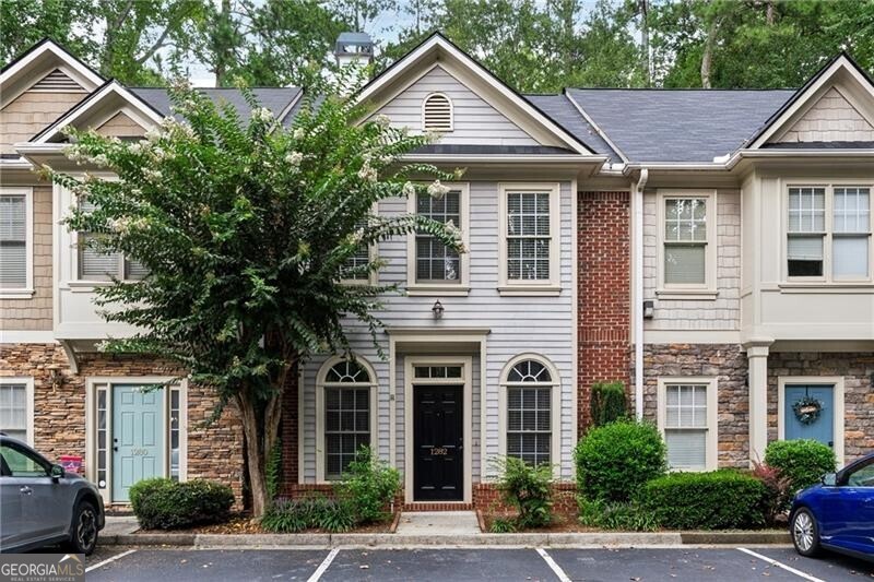 Beautiful townhome in a quiet neighborhood -just 5 minutes from Downtown Alpharetta, Avalon, and steps to Wills Park. The home has been painted throughout with all new LVP flooring added on both levels, all new lighting, brand new rood, new water heater and newer HVAC. The main level boasts an open-concept layout with a light-filled living and dining areas, a modern kitchen with white cabinetry, granite countertops, stainless steel appliances, and a convenient half bath. Off the kitchen you have a private, low maintenance backyard for relaxing and entertaining. On the upper level you will find 3 spacious bedrooms, including a primary suite with walk-in closet, and en-suite bath, and an additional full bathroom to accompany the two other bedrooms. Two assigned parking spots right outside the front door. Move in Ready and ready to call it Home!!!