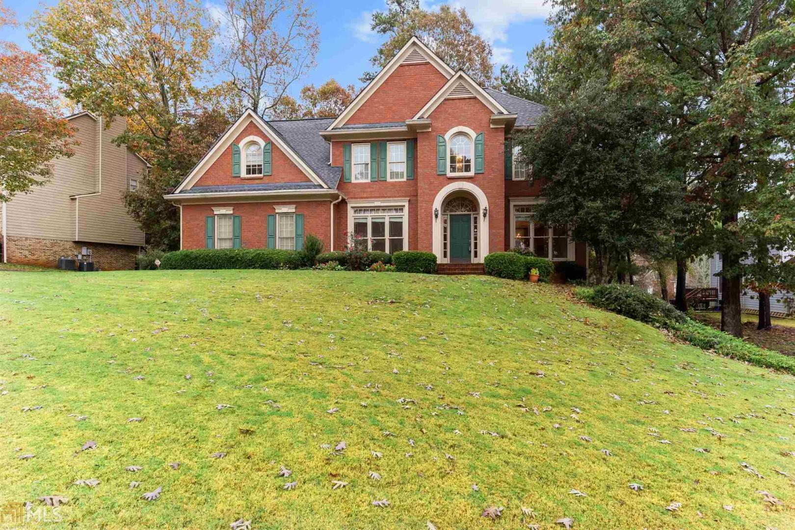 Gorgeous Brick front traditional home. In sought after neighborhood, Edgewater w/ beautiful swim & tennis center. Enter the home through 2 story foyer, with an office or play room on left & formal living room which opens into formal dining room on the right. Hall leads to half bath access to unfinished basement and into white cabinet eat in kitchen w/ breakfast area, granite counters, island w/ breakfast bar, gas cooktop, and tons of storage. Kitchen overlooks vaulted ceiling great room w/ built in bookshelves & gas log fireplace & second set of stairs to 2nd floor. Exit to the deck overlooking backyard from the great room. On the second floor is the Large Master Suite with soaking tub/ separate shower & bonus sitting room w/ 3 large closets. There are also three more bedrooms and a full bath upstairs. Tons of space left in the unfinished basement!