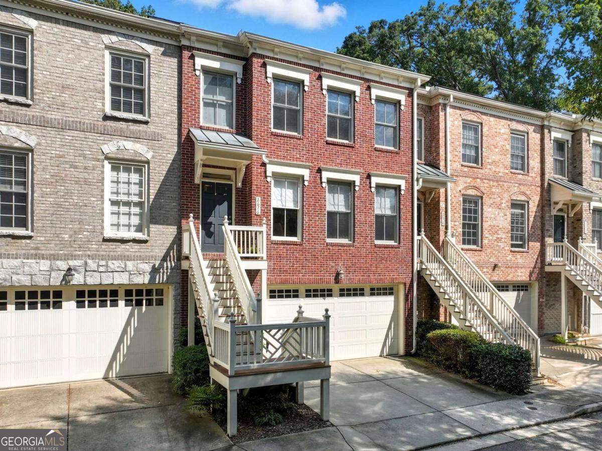 Welcome to the best kept secret in the Eastside's East Lake neighborhood! This boutique townhome community sits on a quiet, cul de sac street, and has amazing walkability to Oakhurst Square, Hosea & 2nd, and East Lake Golf Club. The bottom level features your massive 2-car garage with plenty of room for storage, as well as a perfect guest space and full bathroom. The main level boasts beautiful hardwood floors and an oversized living room with incredible natural light and french doors that open to your large back deck, perfect for indoor/outdoor entertaining. Your open kitchen offers plenty of counter space, cozy wood cabinets, and flows into your large dining space. Follow your hardwood floors upstairs to your bedroom level, which showcases a gigantic primary suite with two closets and a generous primary bathroom. You also have two additional bedrooms, a hall bathroom, and your laundry area at your disposal. As great as this home is, the location is going to be hard to top. In addition to being an easy walk to Oakhurst, Hosea & 2nd, and East Lake Golf Club, you're right around the corner from Downtown Kirkwood, Downtown Decatur, East Lake Park, and MARTA. You're also eligible for the award-winning Drew Charter School. This community also has no rental cap, giving you flexibility now and in the future. Welcome home!