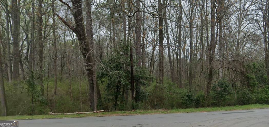 This property offers excellent visibility and high foot traffic in a growing area. Ideal for retail, office, or mixed-use, it features flexible space, on-site parking, and close proximity to I-20, Stonecrest Mall, and local amenities. A great opportunity for investors or business owners looking to grow in a high-demand location.