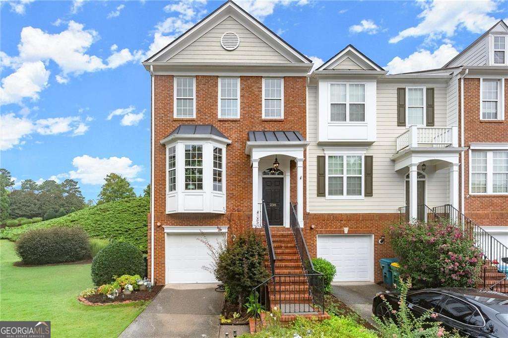 Light-filled, beautifully updated, and packed with charm - this stunning 3-bedroom, 2.5-bath townhome in the coveted Woodlands community blends timeless style with modern comfort. Meticulously maintained, it features a brand-new roof (less than 1 year old), a newer expansive deck, fresh exterior paint, rich crown molding, elegant iron balusters, and stylish newer LVP flooring. The sun-drenched open floor plan showcases generous ceiling heights, abundant natural light, and a cozy gas fireplace, while the spacious bedrooms and versatile lower-level bonus room offer comfort and flexibility. Outside, a private fenced backyard with a quiet, calm patio or the main level deck are the perfect spots for morning coffee, evening unwinding, or hosting friends. Enjoy resort-style amenities including two sparkling pools (one with a thrilling waterslide), 10 tennis courts, pickleball courts, basketball, sand volleyball, scenic nature trails, an expansive playground, and a welcoming clubhouse. Located in Woodstock's top-rated school district and just minutes from vibrant Downtown Woodstock's shops, dining, cultural events, and lush parks, this home offers the perfect balance of luxury, convenience, and community. Don't miss out on this one and come see it today!