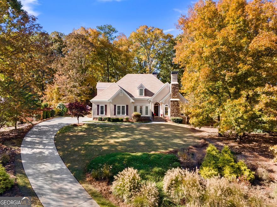 Don't miss the opportunity to tour this stunning 4-bedroom, 3.5-bath traditional home in The Reserve with a new custom heated gunite swimming pool with hot tub! From the moment you enter, you'll notice the warmth of hardwood floors that flow through the foyer, living areas, kitchen, and primary suite. The inviting neutral palette, two gas fireplaces, elegant vaulted and tray ceilings, and an abundance of windows create a bright, open atmosphere filled with natural light.  The spacious kitchen is both stylish and functional, featuring granite countertops, a tile backsplash, gas cooktop, built-in oven and microwave, and a convenient pantry. Overlooking the impressive great room-with its soaring vaulted ceiling and dramatic two-story fireplace-the kitchen serves as the heart of the home.  Additional main-level living spaces include a formal dining room, a cozy living room or home office with its own fireplace, a half bath, laundry room, and a lovely sunroom. The main-floor primary suite offers comfort and convenience, boasting a large bedroom with tray ceiling and a sitting area perfect for relaxing. The ensuite bath includes dual vanities, a jetted tub, and a separate walk-in shower. A guest suite with private bath completes the main level.  Upstairs, you'll find two additional bedrooms connected by a spacious Jack-and-Jill bathroom.  Step outside and experience the new custom heated gunite pool, thoughtfully designed and installed by Solid Rock Pools. This backyard oasis features flagstone pavers, a raised hot tub, a waterfall, and a relaxing bubbler on the tanning ledge. The new landscaping, stone retaining walls, and dry creek bed add to the home's stunning outdoor appeal. When you're not unwinding in the pool or spa, the tranquil koi pond with its gentle waterfall provides a peaceful retreat, all surrounded by mature hardwood trees on a picturesque 0.8-acre lot.  Located close to shopping, dining, and just a short walk from Kennesaw Mountain, The Reserve offers a fantastic lifestyle with community swim and tennis amenities. Owner is a licensed Real Estate Agent.