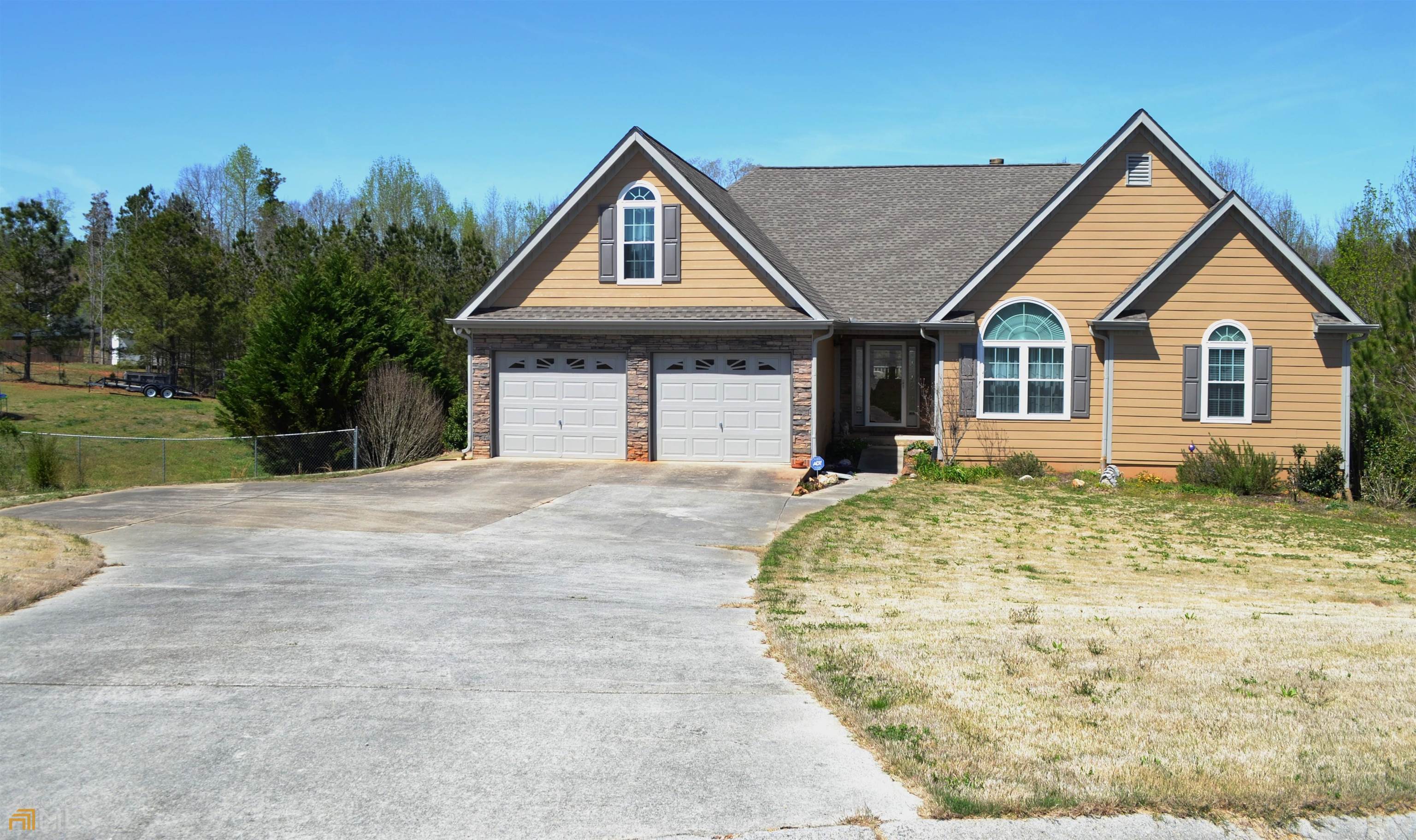 Huntington Park Subdivision. Get ready to say WOW! Move-in ready on 0.92 Acres. 3BR 2BA ranch. Eat in-kitchen with large center island, stainless steel appliances and plenty of cabinets. Beautiful hardwood floors. Separate dining room with wainscoting. Large living room for entertaining, with vaulted ceilings, fireplace and adjoining sitting area. Master suite with trey ceiling, his-and-hers vanities, garden tub and two walk-in closets. Second full bath with large walk-in shower. Separate laundry room. Large deck overlooks a partially fenced yard with plenty of room for gardening or a pool. Lower level features an in-law suite with kitchenette, full bath, and one room used as a bedroom. Two-car garage and workshop with plenty of storage. This one won’t last!