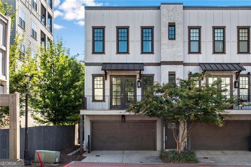 Luxury End Unit in Atlanta's Cosmopolitan Community! This end-unit townhome combines modern elegance with unbeatable intown convenience, offering a vibrant lifestyle surrounded by premier amenities. The main level impresses with soaring 10-foot ceilings, a chef's kitchen featuring custom cabinetry, gas range, and walk-in pantry, and an expansive family room with a gas fireplace, built-in shelving, and dining area. Flooded with natural light, the open floor plan flows seamlessly to a private deck through French doors-perfect for entertaining or unwinding. Upstairs, the primary suite offers a spa-inspired bath with dual vanities, while a spacious secondary bedroom includes its own ensuite for comfort and privacy. On the lower level, you'll find a versatile bonus room that opens directly to a private patio-ideal for a home office, gym, or guest retreat-plus a two-car garage with ample storage. As a resident of the Cosmopolitan at Lindbergh, enjoy an unmatched suite of amenities: a resort-style pool, state-of-the-art fitness center, elegant piano lounge, 24-seat movie theater, and billiards room. Unbeatable Location: Steps from dining, nightlife, shopping, and MARTA, with easy access to I-85, GA-400, Midtown, and Buckhead-Atlanta's best is at your doorstep. Enjoy the sophisticated intown lifestyle you've been searching for!