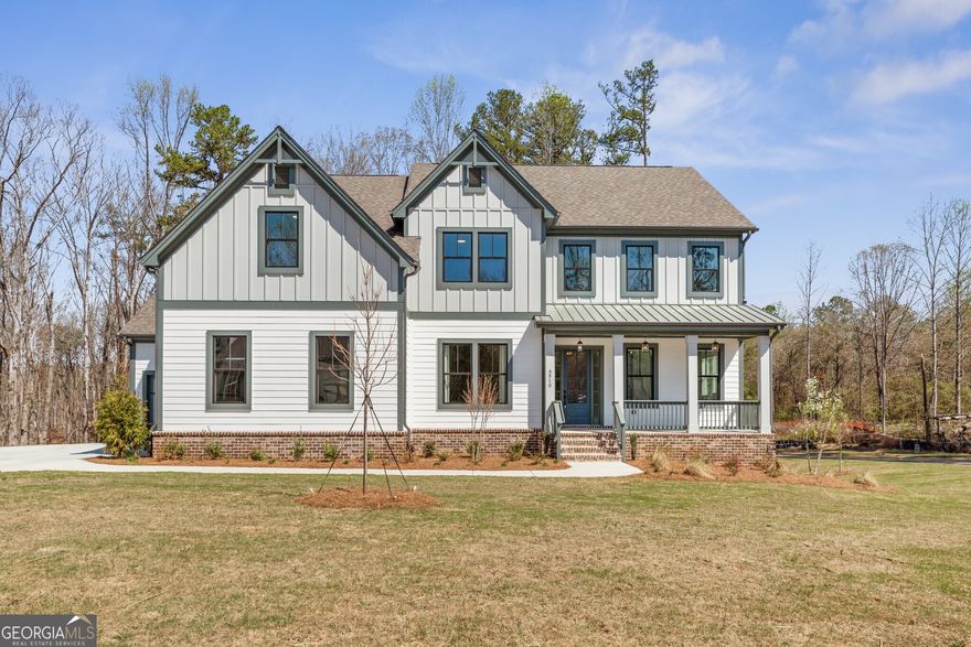 The Bellville Plan by Peachtree Residential. Our official model home! Quick Move-in! This luxurious basement estate is outfitted with all the most beautiful design features - no detail has been spared. You won't want to miss this! Welcomed in by an expansive foyer, on either side you will find a formal dining room big enough for those holiday dinners and a private in-law suite w/ wet bar perfect for guests. Continuing into the home, a towering 2-story family room w/ brick surround fireplace is supplied with vibrant natural light from the huge wall of windows. The family room is overlooked by a sparkling chef's paradise kitchen with wall oven, gas cooktop & vent hood, and gorgeous interior design selections/fixtures. Upstairs your private retreat awaits. The large owner's suite is decked out in the highest fashion with beamed ceiling leading to a spa-like bathroom w/ tile shower & garden tub, make-up counter, chic framed mirrors, and an extensive walk in closet. Rounding out the second level you will find 3 additional spacious bedrooms and 2 bathrooms. Out back is a cozy grilling deck waiting for you to cook up those seasonal meals and enjoy your coffee with the sunrise. All of this on an enormous corner lot w/ a basement makes it THE perfect home. Call TODAY! Ask about our AMAZING incentive with use of preferred lender and binding contract by 10/31/2025 and close by the end of 2025!
