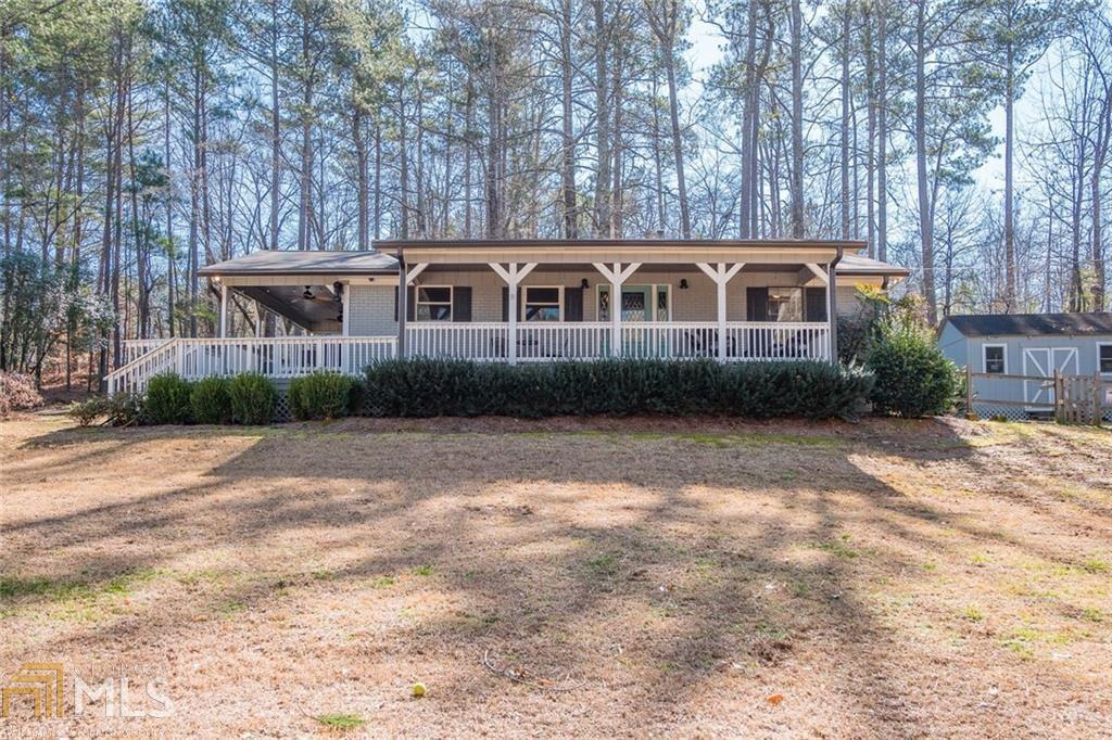 Escape the city to this unbelievable opportunity in a desirable quiet neighborhood! This property features three structures including the Main House, an oversized Additional Building to be finished out for potential rentability or used as additional storage, and a Workshop attached to a chicken coop (or dog house). A portion of the yard is fenced in, and a dog door for easy access to the Main House. The Main House boasts two large walk-out Decks on the side and front of the property.Enjoy your morning coffee on one and entertain in the evenings on the other. Inside the Main House you will find everything is nearly NEW within 2 years is the water heater, the roof, the HVAC, and all electric work. Enjoy all new appliances and a completely renovated Kitchen with an open-concept main living floorplan that combines the Living Room, Kitchen, and Dining Room. The Dining Room spills out into the gorgeous Sunroom that features a picture-perfect cushioned bench overlooking the backyard that can easily be another living area or used as a breakfast nook. The Bedrooms are tucked away for privacy, and the fully renovated bathroom features a solar tube lighting and walk-in tile shower with seat and shampoo cut-out. In the Main House still, you will enjoy an additional two rooms off the rear of the home that could be perfect for more storage, a playroom, or even easily add another bedroom or bathroom for more utility. The possibilities are endless, and this is one home you want to see the first day is comes to the market. Ask about Closing Costs being provided by the Preferred Lender, and schedule your Tour today!