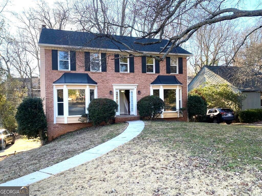 THE PERFECT LOCATION!! Easy access to 400, to schools, shopping, restaurants, walking trails to Martin lake and Chattahoochee River. Minutes to Downtown Roswell. Nature all around. The home features a great yard. Plenty of space for entertaining or work at home. Basement level has full bath and walk out to backyard.