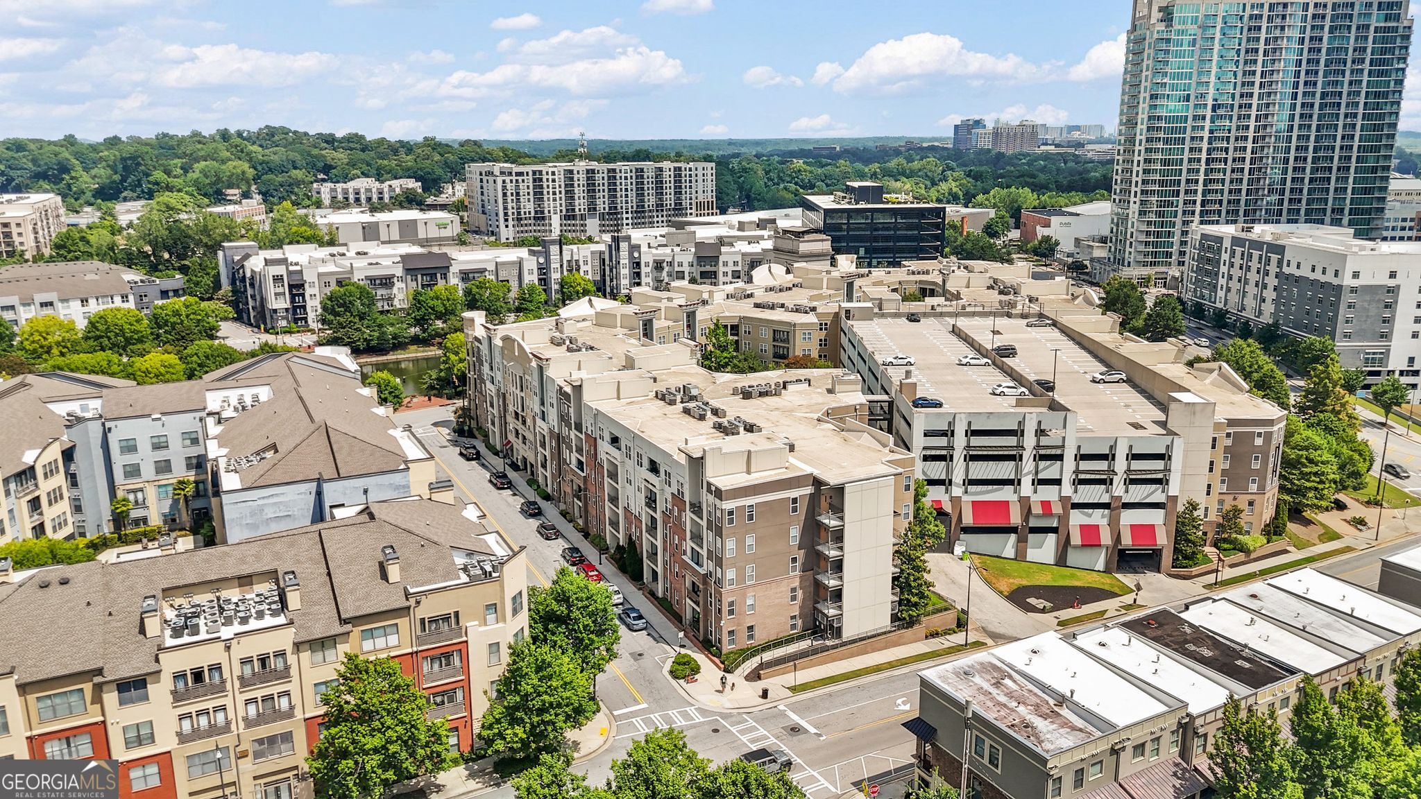 City Living with a View! Step into this beautifully maintained 1-bedroom, 1-bath condo located in one of Midtown's most vibrant communities. Perfectly positioned on the 5th floor this unit offers a thoughtful layout, modern upgrades, and an unbeatable location. The urban convenience, the vibrant city views give easy living! Enjoy a sleek kitchen with granite countertops, stainless steel appliances, custom cabinetry, and a breakfast bar that opens to the bright and airy living space. Whether you're relaxing indoors or sipping coffee on your private balcony, which is accessible from both the living room and the bedroom, you can relax and take in the peaceful energy of the city. The spacious primary suite features direct balcony access, a walk-in closet, and an oversized bathroom with modern double vanities, a separate shower and ample storage. Need a flex space? The bonus room is perfect for a home office, dining area, or guest nook. Enjoy resort-style amenities including a pool, fitness center, dog park, office space, clubhouse, and on-site property management. With many renovations underway to enhance the community spaces-adding even more value to this already amenity-rich community. Note: This isn't just a condo you are getting a lifestyle! The community is gated with security cameras throughout. HOA dues cover water and trash, and guest parking is available with a pass. This unit also includes a separate storage in the building for additional storage and an assigned garage parking spot. Live in the heart of it all. Walk to Publix, Target, IKEA, restaurants, retail, and all the entertainment Atlantic Station has to offer. Minutes from the Microsoft Center, Georgia Tech, SCAD and more. With nearby access to the Georgia Tech trolley, MARTA, and major interstates, your commute is a breeze.