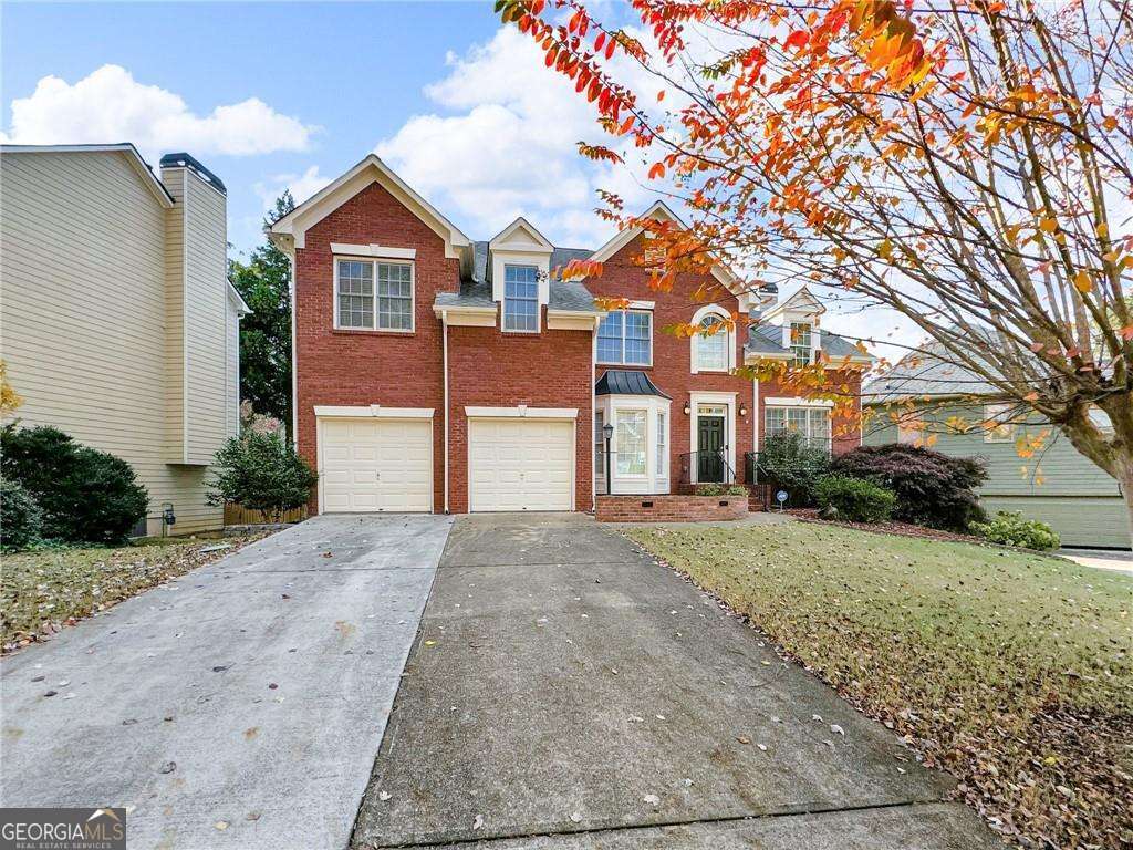 Welcome to 3195 Vickery Dr NE, a stunning 6-bedroom, 4-bathroom home in the highly desirable Vickery Park neighborhood. Ideally located just 6 miles from downtown Marietta, this property offers an exceptional blend of space, privacy, and access to top-rated Cobb County schools. Step inside to soaring ceilings and a thoughtfully designed layout that perfectly balances comfort and functionality. On the main level, you'll find a versatile bedroom that could serve as a secondary master, a formal dining room, and a dedicated office or playroom. The spacious laundry room includes cabinetry for added convenience. The kitchen stands out with its stone countertops, a breakfast bar, and a bright eat-in area, ideal for casual dining. Upstairs, retreat to the oversized master suite with a cozy sitting area, two large walk-in closets, and a spa-like ensuite complete with a jacuzzi tub, separate shower, and double vanity. Two additional bedrooms share a convenient Jack-and-Jill bathroom, each with its own walk-in closet for added storage. The fully finished basement expands your living options with two bedrooms, a full bathroom, a gym or secondary living area, and a large workshop or bonus room, offering endless possibilities for recreation or relaxation. Outside, enjoy one of the largest level lots in the neighborhood, featuring a covered patio, composite decking, a retractable awning, and lush privacy landscaping. The property also includes a sprinkler system (buyer to verify functionality). Additional upgrades include two brand-new AC units with transferable warranties and a 2-car garage equipped with cabinetry and overhead storage. With access to a vibrant community park and pool, paired with a neighborhood celebrated for its welcoming atmosphere, this home offers the perfect blend of space, comfort, and connection-an ideal choice for families or anyone craving convenience and a sense of belonging. Homes in Vickery Park rarely stay on the market, so schedule your showing today and make this exceptional property yours!