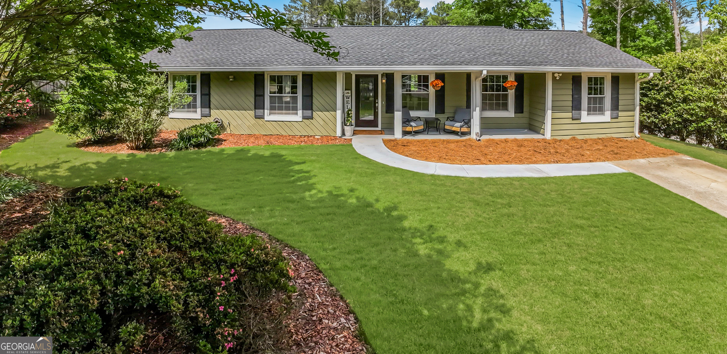 Welcome home to this charming ranch nestled on a quiet cul-de-sac located in the heart of East Cobb, Marietta! Step into the recently remodeled kitchen complete with stunning quartz countertops, brand new stainless steel appliances and an abundance of cabinetry for all your storage needs. The open-concept layout with soaring vaulted ceilings create a bright and airy atmosphere throughout. A spacious multi-functional bonus room offers endless possibilities-ideal for entertaining, a home office, gym, playroom, media room, or anything you can imagine! Step outside to a large, fenced backyard perfect for kids, pets and outdoor living. Garden planters are ready for your own herbs and vegetables. Other features include new wood floors, updated bathrooms, walk-in closet in primary bedroom, expansive deck for relaxing and hosting, and two storage sheds, one with a built-in work bench. Brand new roof! HVAC and water heater both under 5 years old! This home truly has it all, comfort, convenience and charm in a sought-after location with amazing East Cobb schools!