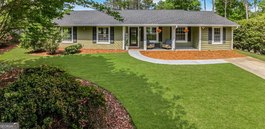 Welcome home to this charming ranch nestled on a quiet cul-de-sac located in the heart of East Cobb, Marietta!  Step into the recently remodeled kitchen complete with stunning quartz countertops, brand new stainless steel appliances and an abundance of cabinetry for all your storage needs.    The open-concept layout with soaring vaulted ceilings create a bright and airy atmosphere throughout.   A spacious multi-functional bonus room offers endless possibilities-ideal for entertaining, a home office, gym, playroom, media room, or anything you can imagine!     Step outside to a large, fenced backyard perfect for kids, pets and outdoor living.  Garden planters are ready for your own herbs and vegetables.  Other features include new wood floors, updated bathrooms, walk-in closet in primary bedroom, expansive deck for relaxing and hosting, and two storage sheds, one with a built-in work bench.  Brand new roof!  HVAC and water heater both under 5 years old!    This home truly has it all, comfort, convenience and charm in a sought-after location with amazing East Cobb schools!