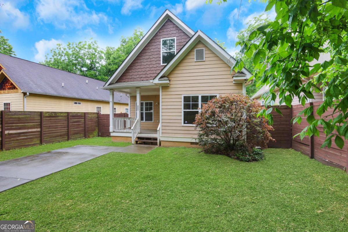 Investor Special - Priced to Sell! Rare find with tons of square footage for the area. This home boasts 5BD/3BA + bonus room that could become a 6th bedroom. Open floor plan with fireside family room, large kitchen, updated master suite, and Jack-and-Jill secondary bedrooms. Upstairs offers 2 oversized bedrooms and a full bath. HUGE lot extends past the fence to the other side of the street-possible buildable space! Minutes to Grove Park, the Quarry, BeltLine, Downtown & Mercedes-Benz Stadium with easy access to I-20 & 285-this is truly a location with upside. No HOA. Sold AS-IS. Savvy investor's dream-recent comps point to up to $100K in equity post-renovation. Don't miss this opportunity!