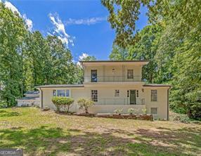 Charming Dream Home on Nearly an Acre in Prime Marietta Location Welcome to your dream home nestled on approximately 0.86 acres, just over the Smyrna line in Marietta. This stunning property boasts an open floor plan filled with natural sunlight streaming through abundant windows, creating a warm and inviting atmosphere from the moment you step inside. The oversized family room is a true showstopper, featuring vaulted and beamed ceilings with recessed lighting, a cozy window seat perfect for relaxation, and custom built-in shelving. The updated kitchen includes textured granite countertops, a porcelain farmhouse sink, and a brand-new GE stainless steel range-ideal for home chefs. Freshly painted inside and out, this home also features a newly installed roof and water heater, ensuring peace of mind for years to come. A standout feature of the property is the incredible artist's studio, designed with rustic warehouse-style accent posts, high ceilings, and exposed beams. Whether you use it as-is or convert it into a luxurious master suite, sunroom, or bonus space, the possibilities are endless. The spacious detached workshop offers even more versatility, complete with a charming room above that's perfect for a private office, creative studio, or playhouse. Hardwood floors run throughout the home, with the exception of the kitchen. Outdoors, the expansive backyard includes a beautiful garden area and a large, flat lawn-ideal for a future pool, playground, or entertaining space. Located just minutes from Smyrna Market Village, The Battery, Silver Comet Trail, numerous parks, I-285, I-75, Cumberland Mall, and a variety of shops and restaurants, this home offers both tranquility and convenience.