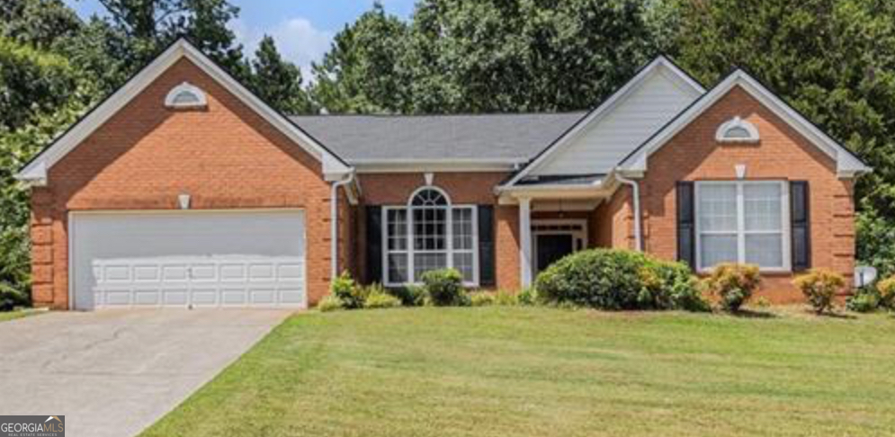 This spacious open floor plan ranch home is nestled in a quiet, established community. The living room has great hardwood floors and a masonry fireplace, while the kitchen features granite countertops and stainless steel appliances and counter that overlooks the breakfast area. Possible 4th bedroom can be used as a sunroom or den. The oversized master bedroom features soaring ceilings and a private master bathroom with a private water closet.Two secondary bedrooms share a bathroom with private vanities. Conveniently located near I-20, this home offers easy access to Villa Rica shopping and dining.