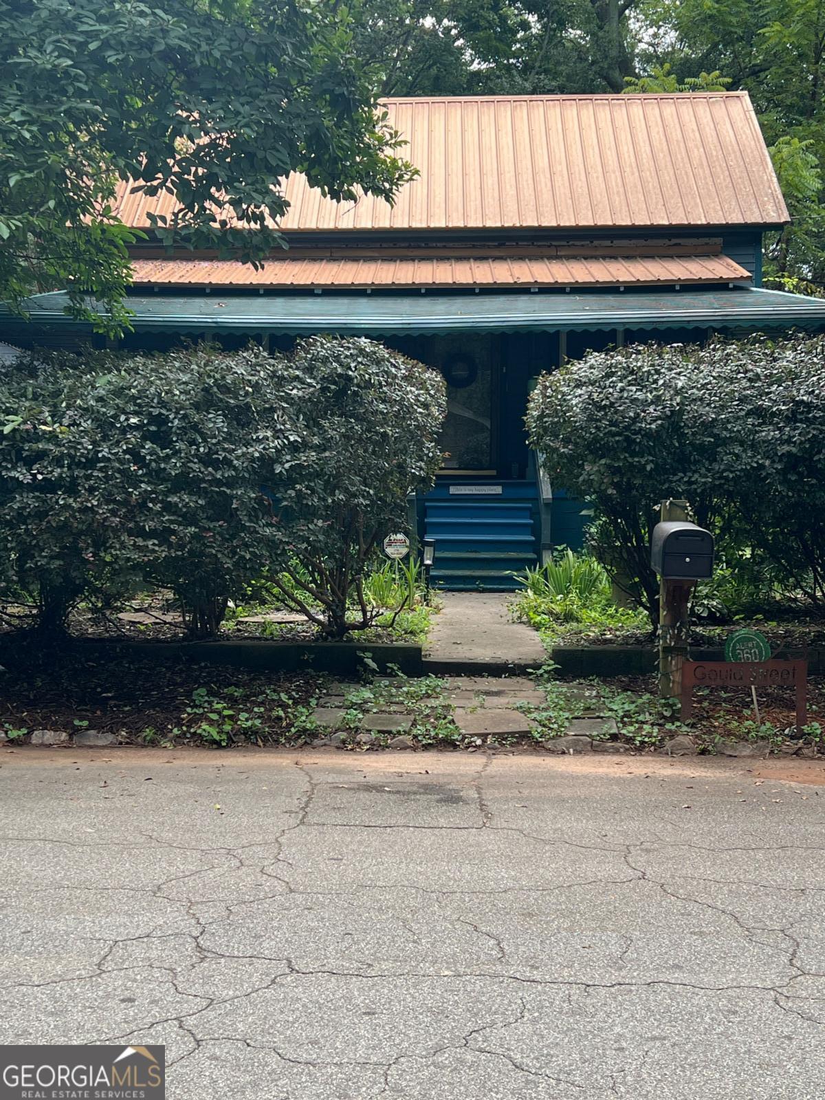 Tucked away in the heart of the city, this hidden gem in Lakewood Heights immediately Welcomes you with its unique charm and character. Situated on a rare double lot, this home is surrounded by lush botanical gardens--from the natural privacy of the front hedge to mature Sugar Maple and Black Walnut trees lining the newly installed privacy fence in the backyard. The property has been thoughtfully maintained and features two rain gardens, seven on-site parking spaces, and an additional spot inside a detached garage. Zoned R4, this property is ideal for a buyer looking to add an accessory dwelling unit (ADU) or convert the garage into a livable space. A separate electrical panel has already been added to support a future kitchen in the garage -- perfect for generating rental income while living in the main home. Designed and owned by a professional designer, the home is filled with distinctive touches both inside and out, including custom textured walls and ceilings, a striking Buddha mural on the garage, and a variety of stylish upgrades: NEW HVAC system (2020), NEW double-hung, double-pane windows (2020), a NEW 50-year copper roof (2020), original hardwood flooring and blown-in insulation for energy efficiency. Location is key--just minutes from walking trails at South Bend Park and only 1.5 miles to two Beltline access points in Grant Park and Peoplestown. Enjoy the location vibe with a latte at Black Coffee or brunch at Love at First Bite. Both walkable from your doorstep. The highly anticipated Terminal South food hall is set to open this summer--adding to the growing list of exciting developments in nearby Chosewood Park along McDonough and Boulevard. Don't miss your chance to own this one-of-a-kind property in booming Southeast Atlanta--perfectly positioned between downtwown and the airport. Schedule your tour today! PLEASE USE SHOWINGTIME FOR EASY SHOWING