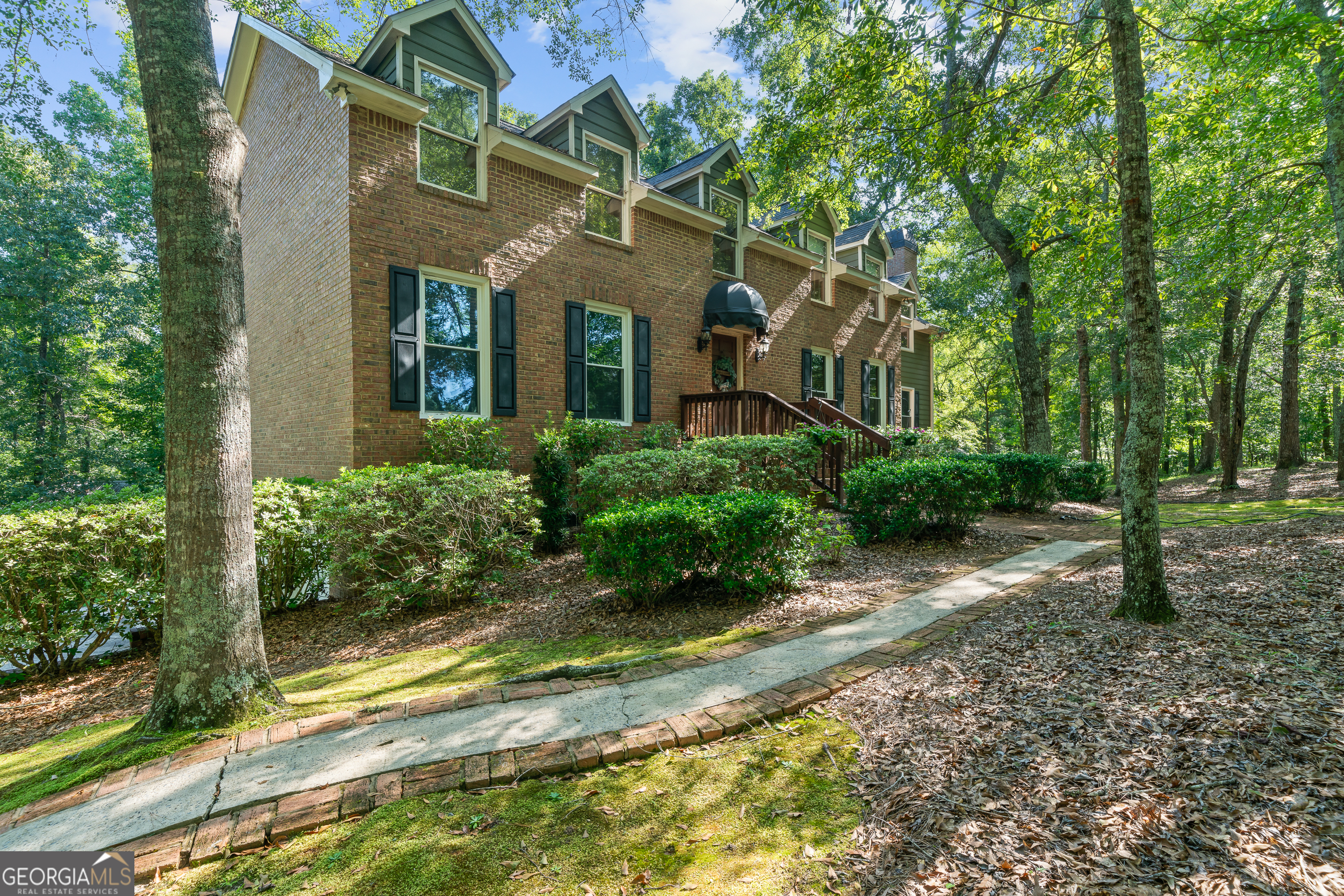 A Hidden Gem in Monroe County - 137 Colebrook DriveTucked away at the end of a cul-de-sac in an established South Monroe County neighborhood, this unique mountain-style retreat offers the perfect blend of peaceful seclusion and everyday convenience. With 6 beautifully cleared and wooded acres that back up to a tranquil creek, you'll enjoy the privacy of country living just minutes from I-75, Macon conveniences, and top-rated schools-including the Academy for Classical Education.Step inside to find character and craftsmanship throughout, including 3" tongue-and-groove hardwoods reclaimed from a rail car, leaded glass accents, and English pub doors. A massive picture window in the living area overlooks the serene acreage, bringing the outside in.The heart of the home features a charming kitchen that opens to a screened-in dining porch and large upper deck-perfect for morning coffee or evening meals under the trees. The primary suite is a peaceful escape with a large primary suite bath showcasing Travertine tile, granite counters, a whirlpool tub, and an oversized walk-in shower.The fully finished basement offers flexible space for an in-law suite, home office, or media room, and walks out onto a spacious lower porch ideal for entertaining.Additional features include:Tankless water heater7-year-old roof and HVAC systemNew ductwork installed 3 months agoOne-of-a-kind fireplace mantle crafted from a historic Hitachi National Forest tree, Custom treehouse, perfect for play and imaginationEnjoy Monroe County taxes and schools, with all the conveniences of Macon just minutes away.Truly a one-of-a-kind retreat that must be seen to be appreciated!
