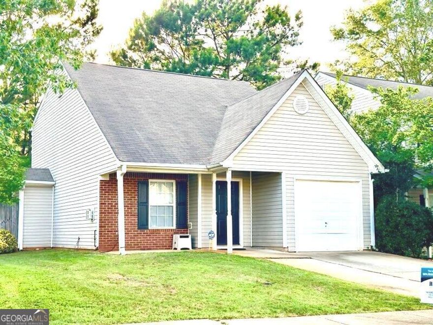 Welcome to this charming 1 1/2 story home! This residence features a spacious bedroom on the main level with an ensuite bathroom, along with a convenient half bath. The first-floor living area includes a cozy corner fireplace, opening to an L-shaped kitchen equipped with stainless steel appliances and updated flooring throughout. The property boasts a fenced-in backyard, a patio, an open front porch, and a one-car garage that has been converted into a versatile media room or office space.    The second level offers a large bedroom, a full bathroom, a separate laundry room, and a bonus room that can serve as an alternate bedroom, exercise room, or any other functional space you desire.    You will love this beautiful home and all it has to offer! Let's discuss using our preferred lender to see if you qualify for 100% financing!