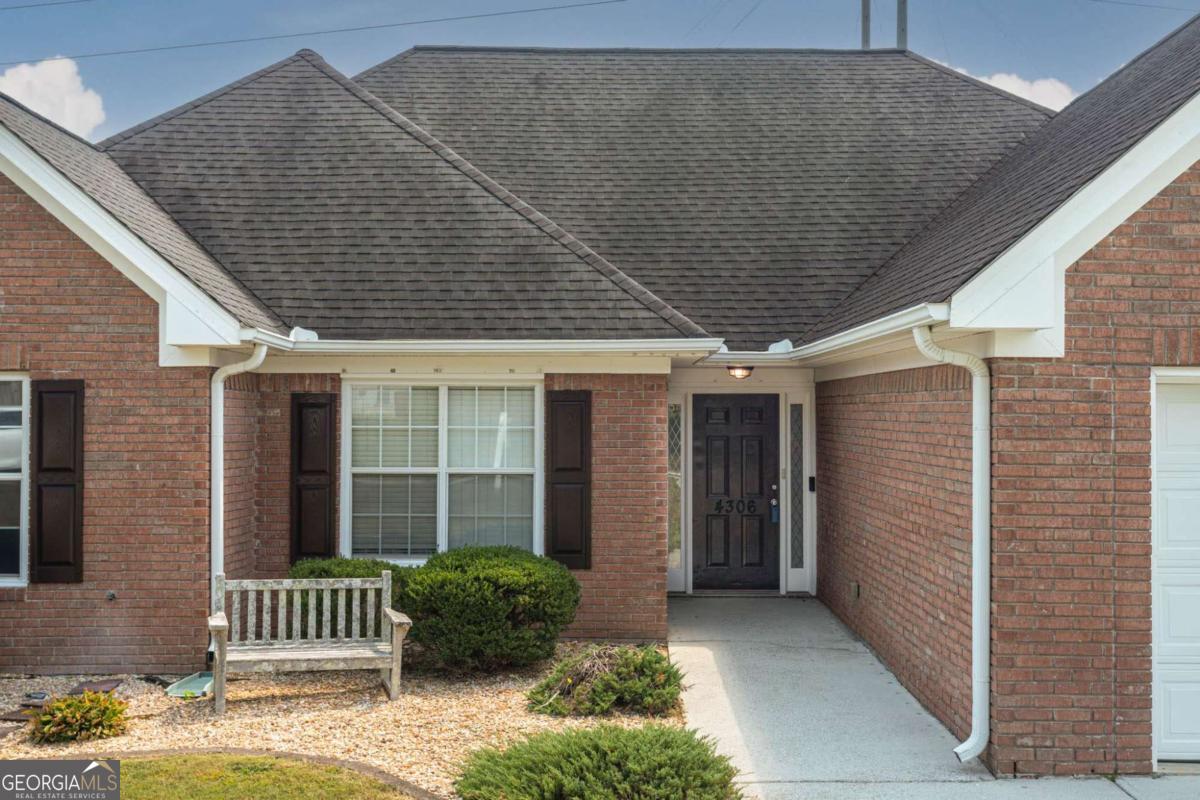 Charming 3-Bedroom Home with Bonus Space in Gwinnett County Schools Welcome home to this well-maintained 3 bedroom, 2 full bath property featuring fresh interior paint and hardwood floors in the main living areas. The brick and vinyl exterior offers timeless curb appeal with low-maintenance living. Inside, you'll find a spacious bonus room that can serve as a 4th bedroom, home office, or playroom to fit your lifestyle needs. The large kitchen is a chef's delight, complete with stainless steel appliances and ample space for meal prep and gathering. Enjoy the enclosed back porch, perfect for use year-round as an additional living or entertaining space. Step outside to a beautifully landscaped and fully fenced backyard with lush grass, irrigation system, and another back porch ideal for relaxing afternoons. This easy-to-maintain home is located in the sought-after Gwinnett County School district, making it a wonderful choice for families. Don't miss the opportunity to make this versatile and inviting home yours!