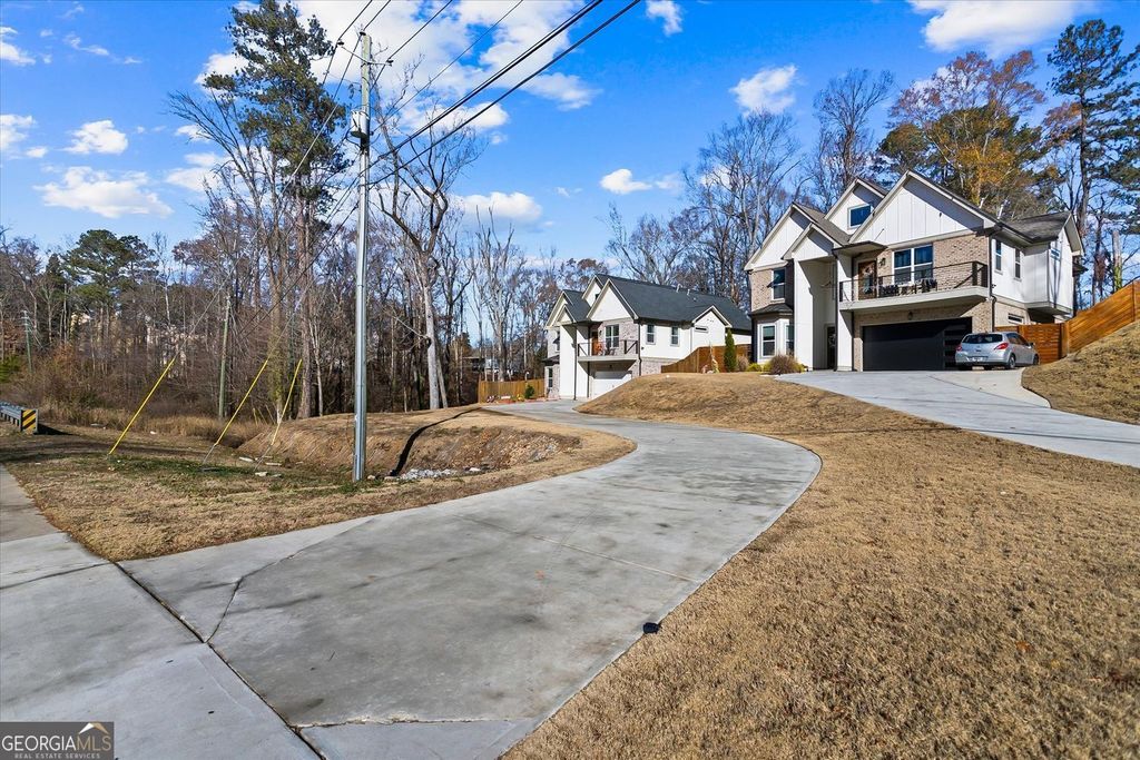 Photo of 658 Rockbridge Road, Lilburn, GA 30047 (MLS # 10693472)