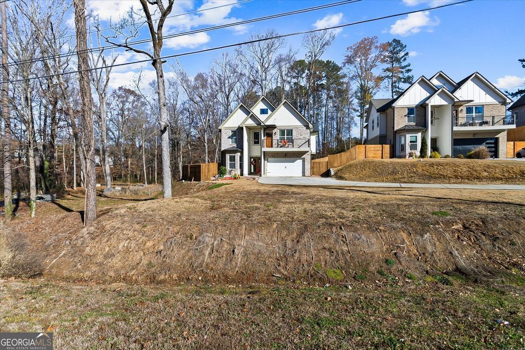 Photo of 658 Rockbridge Road, Lilburn, GA 30047 (MLS # 10693472)
