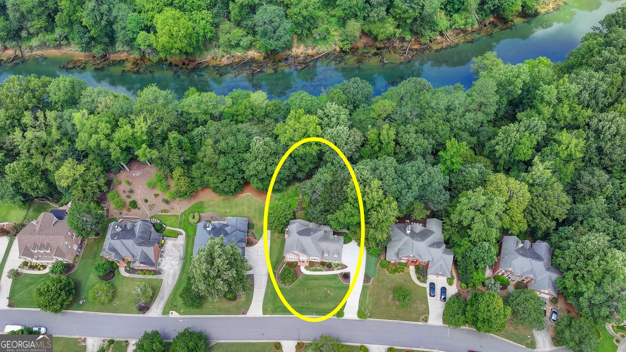 Welcome to this beautifully maintained Chattahoochee Riverfront home in the sought-after Chattahoochee Run community-just minutes from Suwanee Town Center! Nestled on a private lot with three sides brick, this home welcomes you with a bright two-story foyer, refinished hardwood floors, and a modern staircase with sleek black balusters. Inside, you'll find a thoughtfully updated interior featuring a renovated kitchen with granite countertops and stainless steel appliances, a refreshed master bathroom, new carpet, and replaced windows that flood the home with natural light. Over the years, the owner has made numerous high-quality renovations and improvements, and a detailed list is available for your review. Enjoy year-round beauty with professional landscaping and breathtaking river views right in your backyard. The finished basement is full of natural light and offers a flexible layout perfect for an in-law suite, complete with a bedroom, full bath, kitchenette, and multiple living areas with direct access to the serene outdoors. This vibrant swim/tennis community offers exceptional amenities: easy walk to the bus stop and park, where parents often gather and kids play after school; year-round events including parades, Santa visits, and holiday parties; a resort-style pool with competitive swim team, multiple ALTA tennis teams, pickleball courts, fields for soccer, lacrosse, and baseball, beach volleyball, basketball court, and playgrounds with swings, slides, and jungle gyms. Enjoy peaceful walks on the wooded nature trail, relax with some forest bathing, or join the optional community garden. This rare gem blends comfort, community, and natural beauty in a top-rated school district.