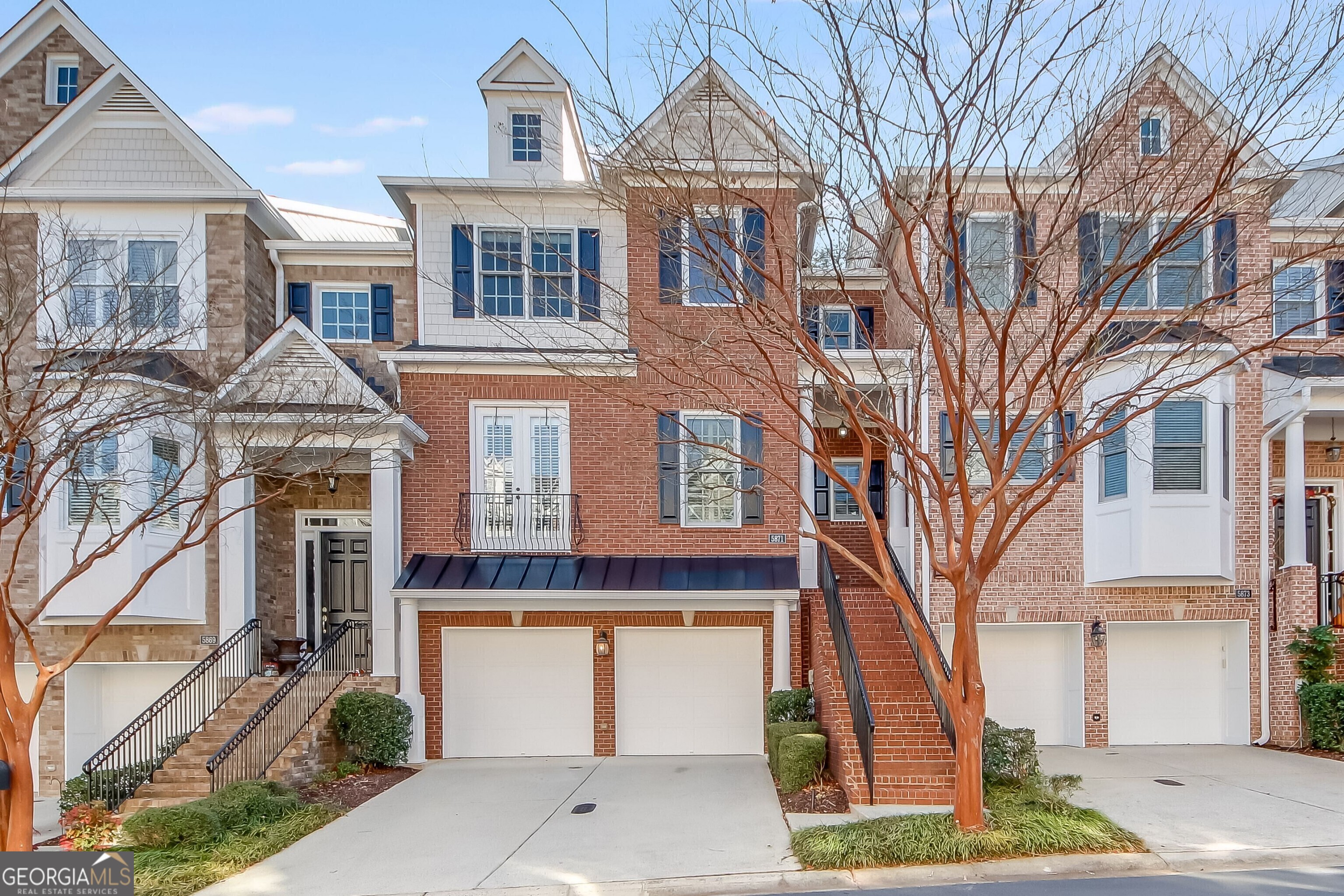 BACK ON MARKET - BUYER FINANCING FELL THROUGH! Welcome to your dream home! This fantastic 3-bedroom, 3.5-bathroom townhome with a full basement is ideally located near The Battery Atlanta and premier shopping destinations. Step into an inviting main floor with an open floor plan, featuring a great room with a cozy fireplace, a breakfast nook adorned with double crown molding, and impressive 11-foot ceilings. The sunroom/office/den offers versatility and leads to a delightful walkout balcony. Hardwood floors grace the entire main floor, complemented by plantation shutters for a touch of sophistication. The separate dining room, with seating for eight, boasts raised panel molding and French doors. The generously sized kitchen is a chef's delight, boasting stainless steel appliances, chic Silestone countertops, cherry cabinets, and a convenient butler's pantry. Upstairs unveils two bedrooms, including an oversized Owner's Suite that defines luxury living. Relax in the spacious sitting area or step out onto your private walkout balcony for a breath of fresh air. The custom walk-in closet offers ample storage, ensuring organization and style. The spa-like bathroom is a retreat with separate vanities, a separate shower, and a jetted tub, creating a haven of relaxation and indulgence. Discover convenience and privacy in the second bedroom on this level, offering its own dedicated bathroom. The finished basement adds valuable living space with a large entertainment room and an additional bedroom with a full bathroom. Perfect for guests or family members, this thoughtfully designed space ensures comfort and autonomy, providing a private retreat within the home. The 2-car garage provides ample space, including a practical work area and storage. Situated in a prime location within the complex, this townhome backs up to woods, ensuring privacy and creating inviting outdoor spaces. Conveniently located near major highways, including I-75, I-285, and I-85, this home beckons you to a lifestyle of comfort and convenience. Welcome home!