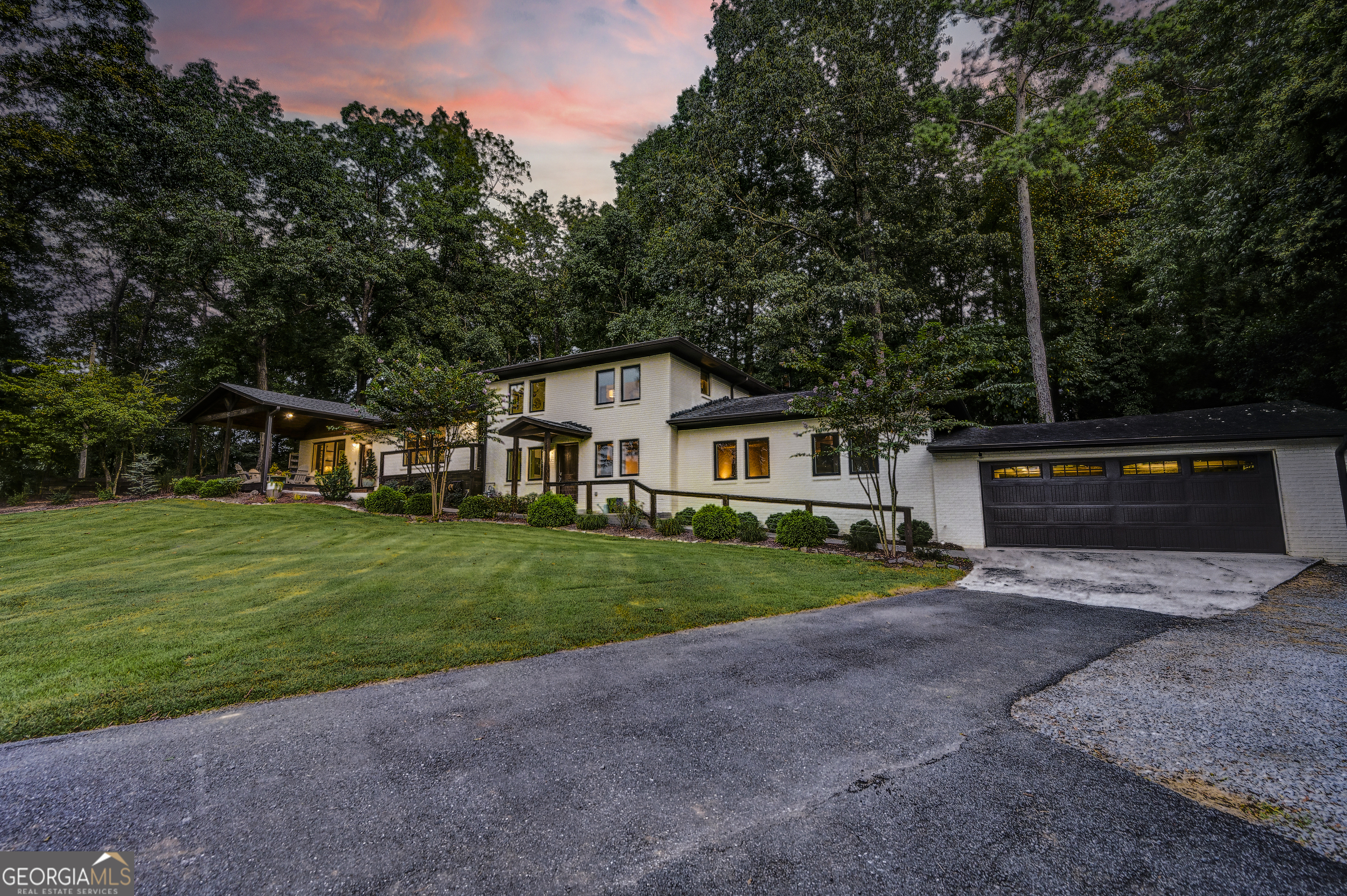 THE MAGNIFICENT MID-CENTURY MODERN WITH SEAMLESS INDOOR AND OUTDOOR LIVING SPACES! Conveniently located just one block from Curtis Parkway sits this EXQUISITE, CONTEMPORARY MASTERPIECE, perfectly perched upon its SPACIOUS, CORNER LOT, which is positioned in the county, but adjacent to city property. Stately lion statuaries atop BRICK COLUMNS welcome you into the driveway, where you are instantly enamored by the property's UNPARALLELED CURB APPEAL. The 4-SIDED BRICK EXTERIOR is met with ARCHITECTURAL-SHINGLED ROOFING, and the TASTEFUL LANDSCAPE accentuates the design and appeal of the estate. From the far east side of the home, under handsome COVERED FRONT PORCH with CATHEDRAL TONGUE-AND-GROOVE CEILINGS, guests embark into the opulent, SUNKEN LIVING ROOM. A romantic, BRICK FIREPLACE is the focal point of the space, which adjoins the kitchen, dining, and gathering/keeping room in a flowing, OPEN-CONCEPT FOOTPRINT. A POWDER ROOM for guest use is strategically located for convenience. The MAGAZINE-WORTHY KITCHEN is any serious cook's desire, and boasts: White shaker cabinetry with sleek hardware, met with custom WOODEN COUNTERS, and lustrous SUBWAY TILE; STAINLESS APPLIANCE PACKAGE, complete with POT FILLER, GAS STOVE, and aproned FARMHOUSE SINK; and Eye-catching BREAKFAST BAR (which doubles as a PREP ISLAND) in a contrasting hue. Travel down the stairs on the way to the Owner's Retreat to the SPACIOUS FLEX ROOM, which is currently being utilized as a MUSIC STUDIO for a professional artist. The home's 3rd wooden-door front entry is located in this space, which could be utilized for a plethora of possibilities, including a HOME OFFICE, or 5TH BEDROOM. Its EXPOSED DUCTWORK adds to the CHARACTER AND CHARM of the space, and includes an ADJOINING FULL BATH and SIZABLE LAUNDRY, accessed by SLIDING BARN DOOR. Two more stairs lead you to the OWNER'S RETREAT, which is the ultimate hideaway for some rest, relaxation, and a little pampering at the end of a long day. Its SPACIOUS BEDROOM with vigorous CONCRETE FLOORING is towered by rich, TONGUE-AND-GROOVE CEILINGS, and features an aesthetic BRICK ACCENT WALL. Its SPECTACULAR PRIVATE ENSUITE with UNIQUE DESIGN offers an unforgettable experience. COLOSSAL CONCRETE SOAKING TUB is accentuated with gleaming subway tile and RAIN SHOWER HEAD SYSTEM. DOUBLE VANITIES are deliberately placed to glorify the space, and are complemented by modern pendant lighting above. A generous WALK-IN WARDROBE to house all your fashions graciously completes the retreat. The UPPER LEVEL features THREE GENEROUSLY-SIZED BEDROOMS, which share a full bath with tub/shower combo. Arguably the most impressive feature of the property is the OUTDOOR OASIS of the backyard, providing a PRIVATE and PICTURE-PERFECT BACKDROP for YEAR-ROUND ENTERTAINING. The COVERED BACK PORCH is adjoined by an OPEN PATIO, as well as a DESIGNATED SPACE FOR a soothing HOT TUB. To the other side, a charming walkway leads to the LUXURY KOI POND, which was thoughtfully crafted to be the centerpiece of the outdoor oasis. The crystal clear water and cascading waterfall offers a peaceful habitat for vibrant koi while enhancing the property's natural charm. ADDITIONAL PROPERTY HIGHLIGHTS INCLUDE: 2 HVAC UNITS (One for bottom and top levels and one for middle level); SOLID SURFACE FLOORING THROUGHOUT; ANDERSEN CRANK CASEMENT WINDOWS; NO HOA; and FENCED BACKYARD. Enjoy tremendous privacy as you drift away from the hustle and bustle, while forgetting that you are LESS THAN A MILE FROM I-75 AND HIGHWAY 53, offering dining and shopping options galore. Do not miss the opportunity to own this ONE-OF-A-KIND, TROPHY ESTATE and call 623 Peters Street HOME!