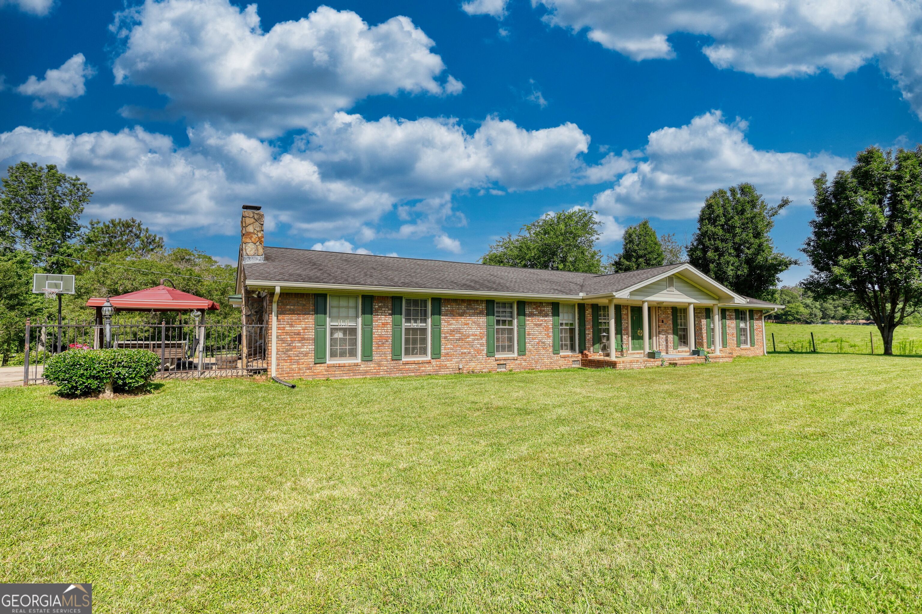 Discover the perfect blend of peaceful country living and modern convenience with this charming brick ranch nestled on 18.52 acres in beautiful Oxford, GA. Whether you're dreaming of a mini farm, a private homestead, or simply room to roam, this property offers endless possibilities. This home offers a traditional ranch layout with 3 bedrooms, 2 full (updated) bathrooms and plenty of space for hosting family and friends! Property also includes a 24x24 , 2 bay workshop and a fully stocked, spring fed pond. Enjoy the serenity of country living without sacrificing location, being only minutes away from shopping, dining and schools. Convenient access to Covington, Loganville, and I-20. Schedule your showing today and make this tranquil escape your forever home!