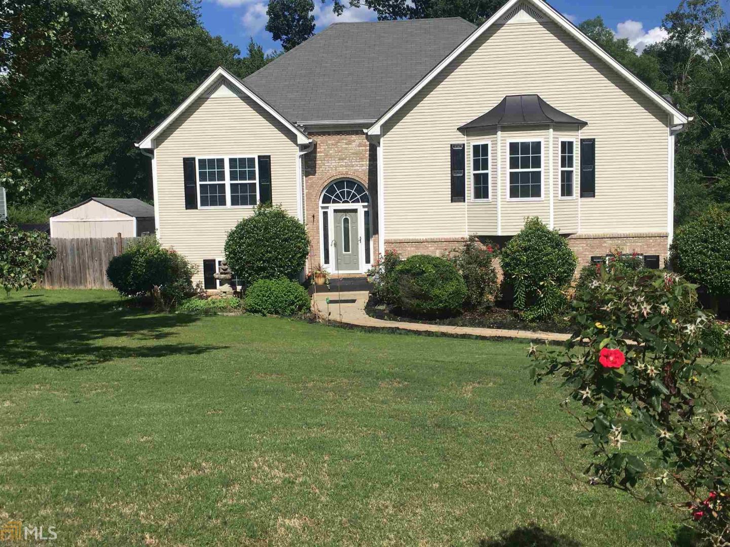 100% financing available for qualified buyers! Priced to Sell! Thousands of Dollars Below the Comps! This 3 bed / 3 bath with wonderful hardwood floors, vaulted ceilings, a breakfast nook, up to date kitchen, all stainless steel appliances, garden tub in master, double vanity sinks, fully finished basement with 3 car garage, will not last long! The screened porch along with large back deck, fire pit and wooden pergola are the perfect spot for entertaining guests, and the middle school is less than 1 mile away! This is what you have been looking for! Brand New exterior doors, Roof is less than 3 years old, Grand Main Entrance , very large family room and heated tile floors in basement bathroom. Come and see your dream home and start packing!