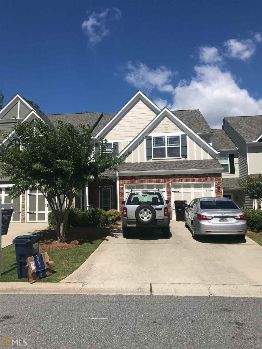 Well maintained townhome in Woodstock with easy access to Roswell and 400. This lovely home has an open plan kitchen to living room with a cozy fireplace and separate dining room. The kitchen also has a deep pantry and a sep. laundry room. When you walk up the stairs you will be surprised to see a small loft space, an oversized master suite, two ample sized secondary bedrooms and a hall bathroom. The backyard has a patio with privacy fences, as well as shared green space beyond for you dog lovers. Across the street there is a community green space for kids to play.