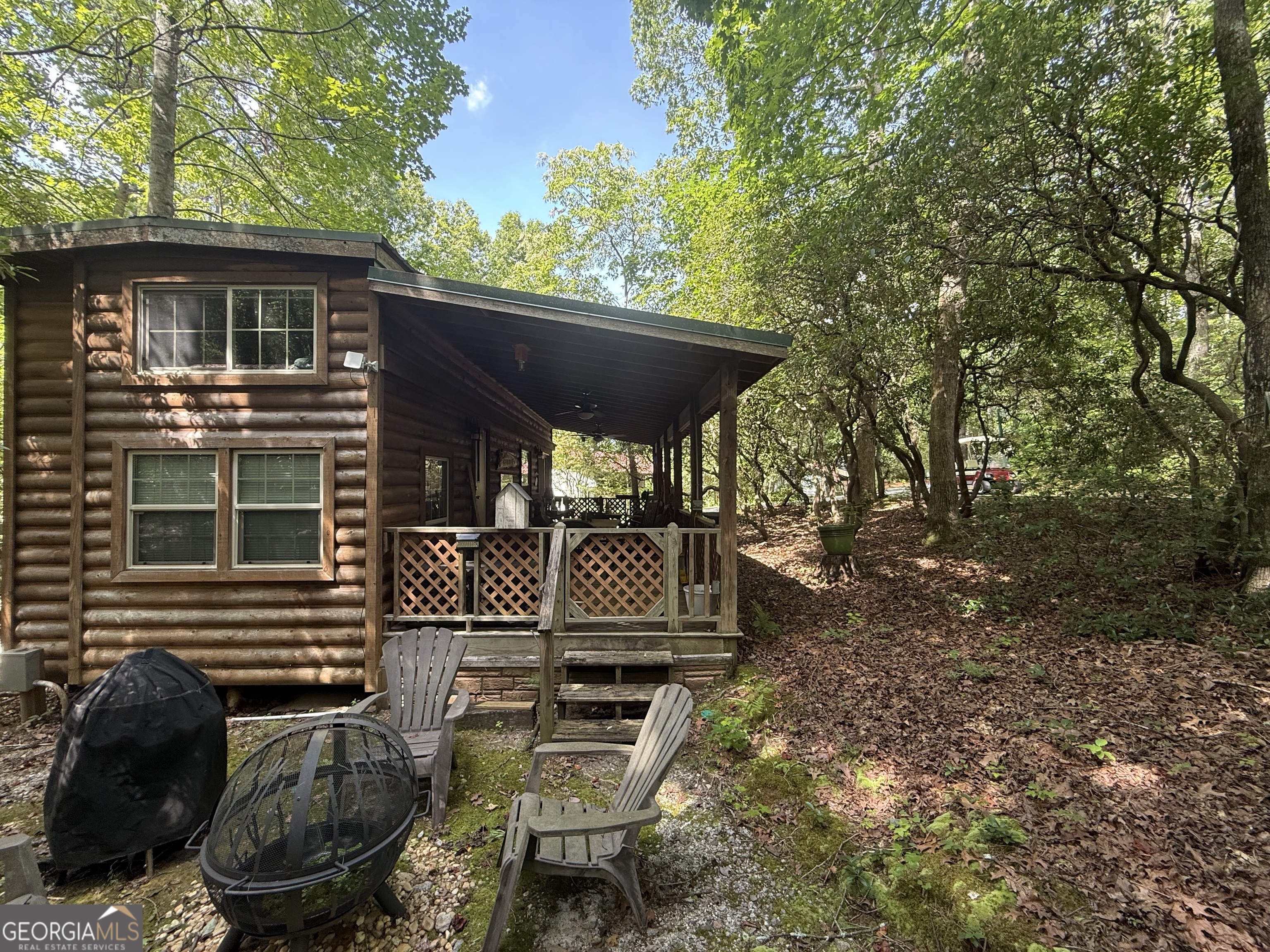 Cozy 2009 Park Model Cabin with Loft in Mountain Lakes Resort - Cleveland, GA Escape to the North Georgia mountains with this charming 2009 cabin-style park model located in the desirable Mountain Lakes Resort subdivision. Combining rustic charm with modern convenience, this property is perfect as a weekend getaway, family retreat, or potential short-term rental investment. Inside, you'll find a private bedroom along with an expansive loft that can comfortably sleep up to four, making it easy to host family and friends. The soaring ceilings and open living area create a spacious, inviting atmosphere, while the natural mountain laurel landscaping enhances the peaceful setting. This property sits on a larger-than-average lot, offering ample parking and plenty of room to spread out. You'll love the huge side porch, ideal for entertaining, as well as a separate storage building for all your outdoor gear and seasonal items. Mountain Lakes Resort is a gated community loaded with amenities, including: Three swimming pools, including one indoor for year-round fun A 55-acre private lake for fishing, kayaking, and paddle boating Stables offering horseback riding for all ages An on-site church, country store, and diner Weekly family activities, including Saturday night bingo, karaoke, and seasonal events Whether you're sipping coffee on the porch, enjoying a day on the lake, or joining the community events, this property delivers a true mountain lifestyle. With its spacious loft, oversized lot, ample parking, and resort-style amenities, this park model is both a relaxing escape and a smart investment opportunity. Don't miss your chance to own your slice of Mountain Lakes Resort!