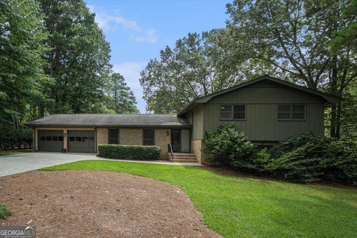 Prime Dunwoody Opportunity - Investor Special or Dream Home in the Making! Unlock the potential in this sprawling split-level home, ideally situated on a flat, 0.61-acre lot in one of Dunwoody's desirable and established neighborhoods. Whether you're an investor seeking high ROI, a renovator with a vision, or a homeowner ready to customize, this property is a rare find with endless possibilities. With strong bones, original charm, and an abundance of natural light, the home offers a generous layout and flexible spaces that can be reimagined to suit any lifestyle. Highlights include spacious bedrooms, multiple living areas, and a versatile flex space - ideal for a home office, rec room, playroom, or gym. Original architectural details provide an opportunity for restoration or modern updates. The private backyard oasis features a pool, perfect for summer entertaining. Level lot offers potential for expansion or custom outdoor enhancements. Top-tier Dunwoody location close to parks, schools, shopping, and dining like Brook Run Park, Pernoshal Park, Georgetown Park, Dunwoody Village, and just minutes from Perimeter Mall, Downtown Chamblee and Historic Roswell, with easy access to I-285, 85, PIB, and GA-400! Bring your vision and transform this property into a modern masterpiece or income-generating asset. Whether you plan to flip, rent, or settle in long term, the location, lot size, and layout offer a rare combination of value and potential. Here's your chance to secure a versatile property in one of Atlanta's most coveted communities-opportunities like this don't last!