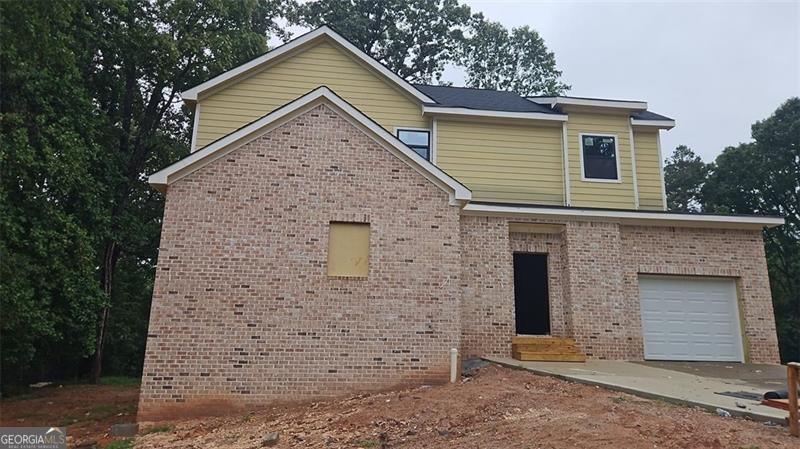 New Construction Home in Gwinnett County - Award-Winning Schools! Welcome to this beautiful 4-bedroom, 2.5-bath new construction home, located in a quiet, established neighborhood in sought-after Gwinnett County. Situated in an award-winning school district and conveniently close to Mall of Georgia and Sugarloaf Mills, this home offers the perfect blend of modern living and everyday convenience. Step inside to a spacious open-concept layout, where the living, kitchen, and dining areas flow seamlessly-ideal for gatherings and family time. The oversized master suite features a luxurious bathroom and an expansive walk-in closet, creating a serene personal retreat. With three additional bedrooms, there's ample space for family, guests, or a home office. Enjoy the charm of a seasoned community with mature trees and a peaceful atmosphere-all while owning brand-new construction. Currently under construction and nearly complete, this home offers a rare opportunity to enjoy modern design, top-tier schools, and unbeatable access to shopping, dining, and entertainment at two of Gwinnett's premier malls.