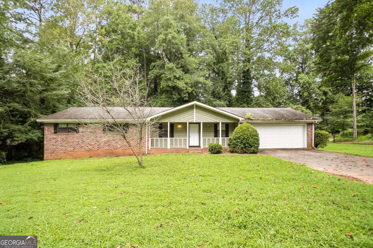 Nestled in the established and well-kept Concord Ridge neighborhood, this 4-bedroom, 3-bath ranch offers a great opportunity for those seeking value and potential. The main level features a vaulted family room with a cozy fireplace, a spacious kitchen with a breakfast area, and three bedrooms, including a master suite with its own bath. A separate dining room and welcoming front porch add to the charm. The finished basement includes an additional bedroom and full bath, perfect for guests, a home office, or extended living. The unfinished portion of the basement offers even more room to grow-ideal for storage, a media room, or future build-out. Set on a level, wooded lot, this home is perfect for buyers ready to bring their vision and make it their own. Conveniently located near shopping, public transportation, and major roads.