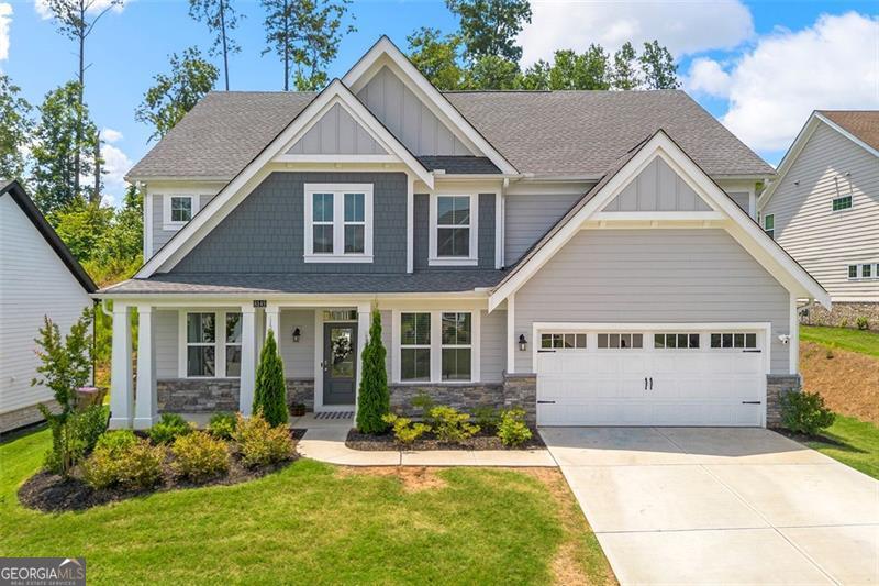 Welcome to the beautifully upgraded 4- bedroom, 2.5 bath home located in a quiet cul-de-sac in the desirable River Rock Community of Ball Ground. This spacious residence sits on a large level lot and offers the perfect blend of comfort, privacy and outdoor living. Designed for entertaining and everyday family life. The home features a stunning oversized porcelain patio, a charming gazebo, and mature privacy trees that create a peaceful, secluded backyard- ideal for hosting guests or letting the kids and dogs run freely. Inside, you'll find an open-concept layout with a bright modern kitchen, a generous island, and a cozy family room that flows effortlessly. The large polyaspartic coated garage floor adds both style and durability, making the garage feel like an extension of the home. Residents also enjoy resort-style community amenities including a pool, club house, playground, tennis courts and walking trails. Don't miss your chance to make this home yours!