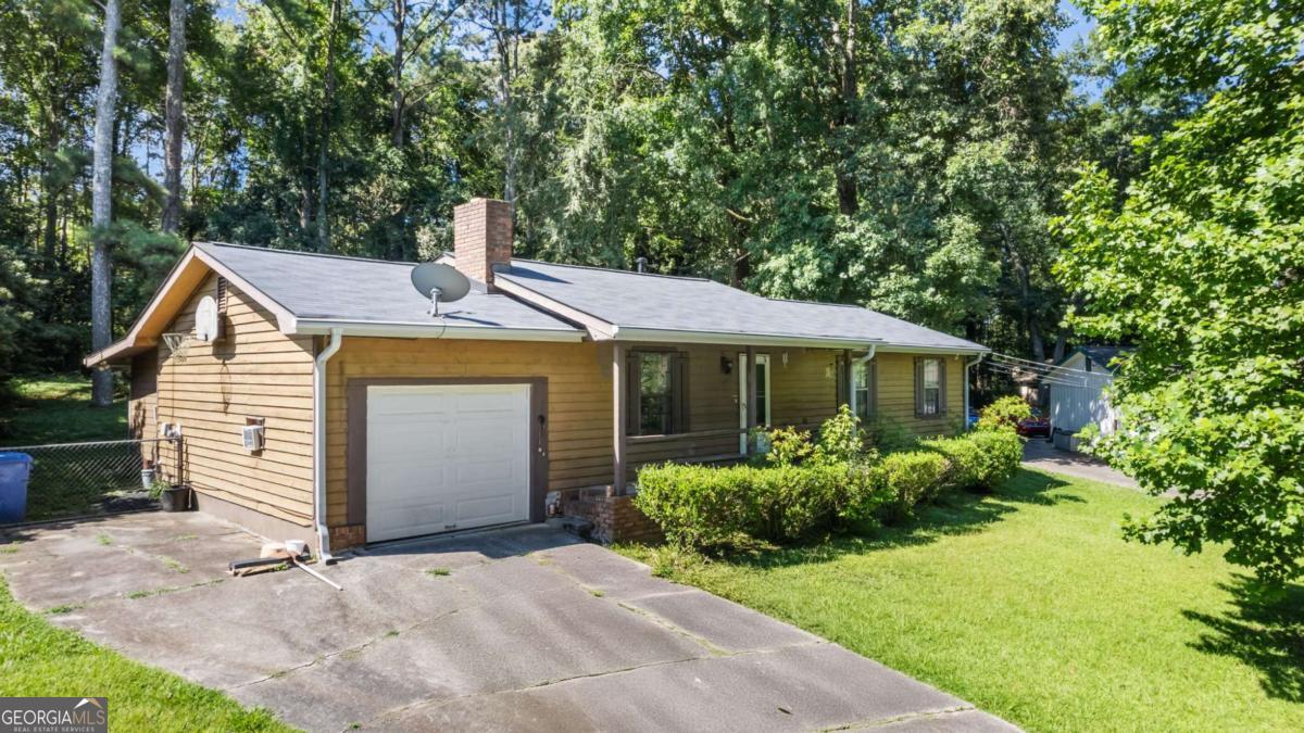 Investor Special on Quiet Cul-de-Sac - Tons of Potential! Located in a quiet cul-de-sac just minutes from I-75, shopping, and restaurants, this home offers a rare opportunity for investors or savvy home buyers looking to add value with a little TLC. Highlights include a private, level backyard, fireplace in the living room, large laundry room, and a stepless shower in the master bathroom. The roof is only 2 years old, and the interior HVAC unit was replaced in 2023, providing a solid foundation for the big-ticket items. All appliances remain, and there's a one-car garage for added convenience. This home is situated in a quiet, established neighborhood, offering both privacy and convenient access to major amenities. With some cosmetic updates, it has the potential to shine, whether you're fixing it up to flip, rent, or occupy. Don't miss this opportunity-homes in this location go fast!