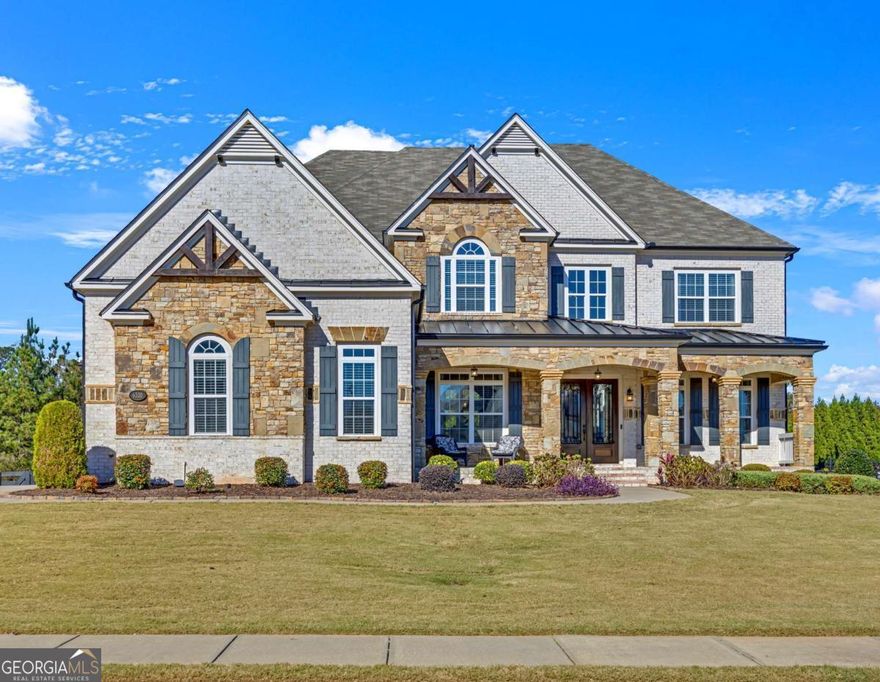 A masterpiece of custom design and grand scale, this home defines elevated luxury living. Beyond the stately double front doors, a dramatic two-story foyer unfolds, crowned by a stunning crystal chandelier that swirls gracefully from the ceiling in a cascading design. From there, you're drawn into a breathtaking 24-foot coffered ceiling living room, where sunlight pours through a curved panorama of floor to ceiling windows, illuminating the brand new hardwood floors and a floor to ceiling stone fireplace that anchors the space in style and warmth. The open layout flows seamlessly into the gourmet chef's kitchen, featuring sleek granite countertops, designer cabinetry, and top-of-the-line stainless steel appliances, with access to a spacious deck ideal for entertaining. Elegant crown molding and refined architectural detailing enhance the home's sense of scale and craftsmanship. With five fireplaces, two impressive kitchens, and a main level guest suite with private ensuite, this home blends style and functionality effortlessly. The owner's retreat is a private sanctuary with a cozy fireplace sitting area, spa inspired bathroom, and an expansive walk-in closet. The fully finished basement feels like a second home, complete with a 2nd gourmet kitchen, huge open living area, private suite, and a modern full bathroom; perfect for guests, in-laws, or entertaining in style. Meticulously maintained, energy efficient, and featuring a surround sound system and three car garage, this exceptional residence is ideally located near Halcyon, Vickery Village, top schools, and premier shopping. This one checks every box! Fall in love. Move right in!