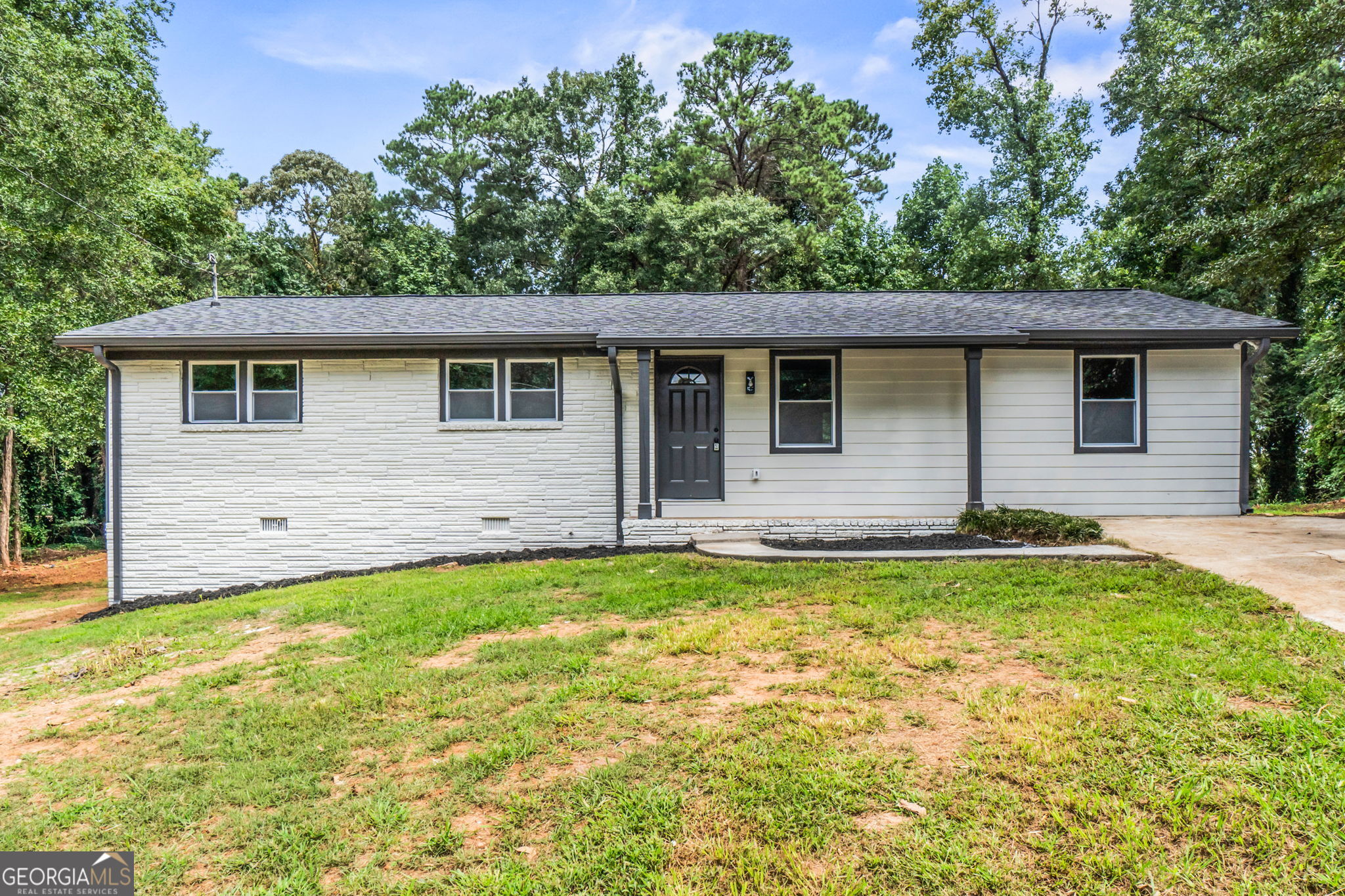 Welcome to this beautifully renovated 3-bedroom, 2-bathroom ranch-style home, offering a perfect blend of comfort, style, and functionality. As you enter, you're greeted by an open-concept layout that seamlessly connects the living room, dining area, and fully updated kitchen. The kitchen features stunning new cabinets, sleek quartz countertops, and a stylish backsplash-perfect for both cooking and entertaining. Both bathrooms are fully tiled with modern finishes, providing a spa-like feel. The home boasts brand-new flooring, energy-efficient windows, upgraded insulation, a new roof, new HVAC system, new water heater, and even a new septic tank-giving you peace of mind for years to come. Step outside to a large backyard with endless possibilities for outdoor living, gardening, or entertaining. This move-in ready home is a must-see!