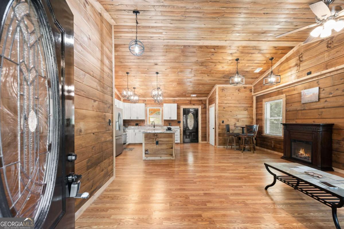 Brand NEW custom personal built LOG Cabin. Granite counter tops, top of line appliances, tile bathrooms, large master closet. The Cabin on the mountain is set on 5.19 acres, decently cleared around the house and front yard, yet it is set back far enough for some private front porch sitting with some woods for privacy to enjoy mother nature and all the wildlife that cruises by. The cabin is set up with a home generator, storage shed, and a small shed/workshop. All interior items stay. This is mountain living at it's best!