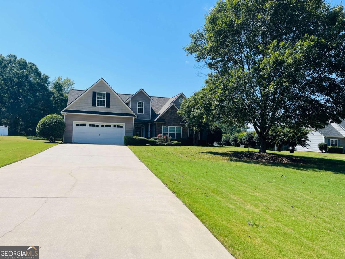 Welcome to this stunning 3-bedroom, 2-bathroom home set on 1.6 acres of peaceful land. Step inside to find gleaming hardwood floors and an open, inviting floor plan perfect for everyday living and entertaining. The spacious kitchen features granite countertops, stainless steel appliances, and abundant storage. The primary suite is filled with natural light and offers a spa-like bath with dual vanities, a soaking tub, and a separate shower. Two additional bedrooms provide generous closet space and comfort. Above the garage, a versatile flex room is ideal for an office, playroom, 4th bedroom, or whatever suits your needs. Outside, enjoy a large yard with a great patio for entertaining, plus two storage sheds available for tenant use. As an added bonus, landscaping is included in the rent-so you can relax and enjoy the beauty of the property without the upkeep. This home truly has it all-schedule a showing today!