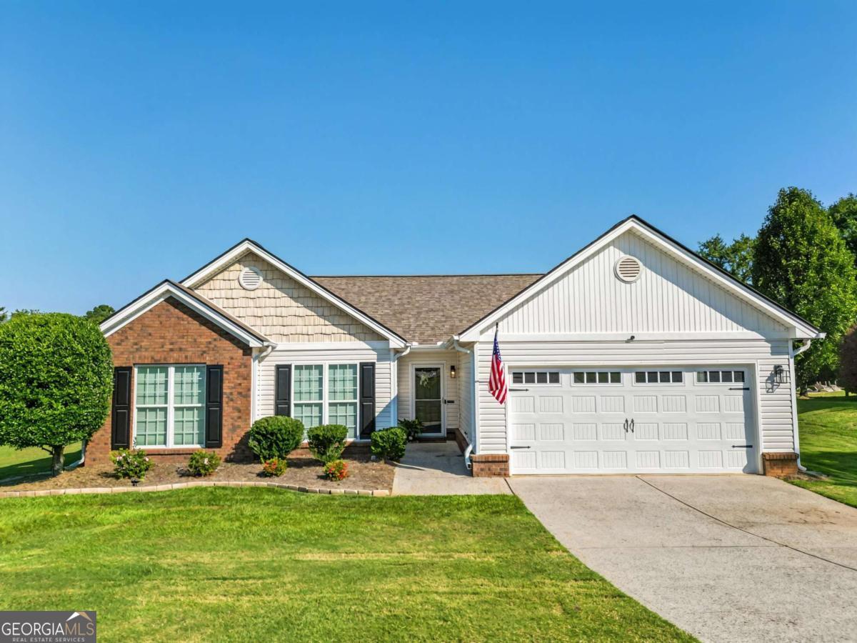 Welcome to 203 Lucas Way, Statham, GA - a charming 3BR/2BA ranch in a well-established neighborhood just minutes from Athens. Features include a vaulted family room with brick fireplace, open dining area, and kitchen with breakfast nook. Spacious owner's suite offers trey ceilings, walk-in closet, garden tub, and a separate shower. Enjoy a huge privacy-fenced backyard with covered patio, perfect for relaxing or entertaining. Plus, a 2-car garage and move-in-ready convenience!