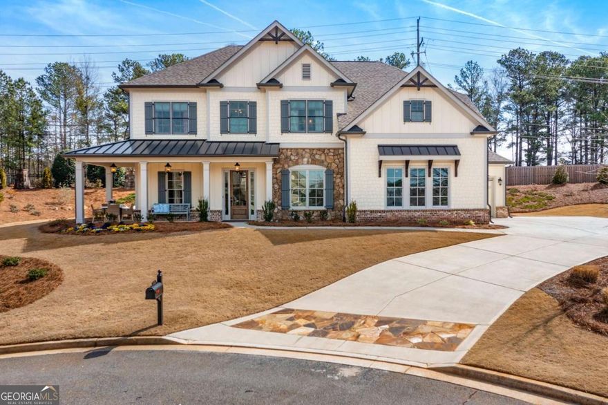Welcome to this extraordinary 2022 turn-key addition in charming Ellis Farm neighborhood. Warmth and understated sophistication make this residence ideal for discerning buyers preferring effortless living within an iconic community. Perched on almost half an acre, the home enjoys traditional columns and brick inlay along the front porch, inviting neighborly visits for sunset views. Entering the home, an abundance of natural light cascades through the Foyer. Designer-inspired touches, such as curated chandeliers and wallpapers, grace the main level. Oversized custom French doors lead to a lovely warm-hued room, now enjoyed as a Home Office. This room easily may become a main-floor Guest Bedroom Suite; the adjacent closet, a convenient Micro-Work Station. Across the expansive Foyer, the stellar Dining Room hosts eight to ten for memorable gatherings. Competing for attention is the custom-designed Charleston Pantry, making entertaining a breeze-whether it's morning coffee and tea or evening cocktails and wine. A tall, 3-zone wine cooler holds most beverage options. The heart of the home is the grand Family Room with its thoroughly modern gas fireplace and soaring 12' mantel. Here is the center of activity: elegant, oversized glass doors lead to the screened Outdoor Room; high functioning, stainless appliances staff the bright, eat-in Gourmet Kitchen; floor to ceiling shelves command a separate Kitchen Pantry; and sliding doors open to a thoughtfully landscaped yard, equipped with water-conserving drip-and-shower irrigation system. Hardwood floors, sealed with additional finish, continue up the staircase and through the serene Owner's Suite. The tailor-made paneled doors lead through the spa-inspired Bathroom and on to the stunning Dressing Room. The day begins and the sun sets in this calm and curated order. Back in the Hallway, hardwood floors give way to herringbone tile in the Laundry Room. A handy, customized Linen Closet helps keep vacuum and cleaning necessities organized. Three additional bright and spacious bedrooms are located upstairs, one with an ensuite bath and bespoke closet. Along the Hallway, beautiful millwork creates a cozy Library entryway. The window-seat is a dreamy treetop vantage point!  Facing the Library, three wide steps lead to the Flex Room, currently serving as a sophisticated Game Room-complete with stunning pool table and smart television. Envision the possibilitiessuited for this amazingly elevated space!    Ideally located within walking distance of Kennesaw National Park, this home provides easy access to historic Marietta Square, fine dining, top-rated schools and outdoor activities.