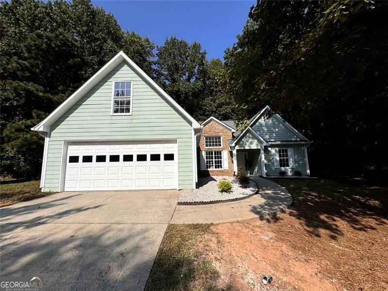 Beautifully updated ranch tucked away on a quiet cul-de-sac with soaring vaulted ceilings, a marble-framed fireplace, and a spa-like primary suite with stand-alone tub. Modern upgrades include quartz countertops, new flooring, and a brand-new water heater. Enjoy nearby parks, shopping, dining, and golf-all just minutes from your doorstep. Tucked away on a peaceful cul-de-sac, this beautifully updated 3-bedroom, 2-bath ranch offers the kind of serenity that makes coming home feel like a retreat. Step inside and the welcoming living area immediately draws you in with its soaring vaulted ceiling and marble-framed fireplace-a perfect setting for cozy evenings or relaxed gatherings. The kitchen blends style and function with granite countertops, stainless steel appliances, and both a formal dining room and a sunlit breakfast nook, giving you options for everything from casual mornings to special occasions. The primary suite is designed for comfort, featuring a spa-like bathroom with a stunning stand-alone tub and sleek quartz-topped vanities. Both bathrooms showcase the same modern finishes, while new flooring and LED lighting create a fresh, airy feel throughout. With a newer roof, HVAC, and a brand-new water heater, the home combines beauty with peace of mind. Beyond the front door, the location connects you to some of Dacula's most sought-after amenities. Spend weekends exploring the walking trails, open fields, and scenic spots at Rabbit Hill Park, Dacula Park, and Little Mulberry Park. For shopping, dining, and entertainment, you'll be just minutes from The Shops at Hamilton Mill, The Exchange at Gwinnett, and the Mall of Georgia. And when it's time to unwind, the Hamilton Mill Golf Club offers a perfect way to enjoy the outdoors. Note: A beautiful frameless glass shower door with brush gold finishes has been ordered for the master bathroom and will be installed prior to closing Preferred closing attorney: Melanie Mayer, LLC Your perfect home is ready for you... Come see it today !