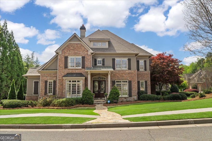 The bespoke home for the buyer seeking classic traditional design blended with the best of current style. Unsurpassed quality and luxury in very recent renovations present this fine residence as if from the pages of Veranda Magazine. Impressive 12' coffered ceiling with marble fireplace and expansive windows washing the great room with natural light. Connecting this lovely space to the comfortable, casual family room is a chic wet bar with wine cooler making the flow ideal for entertaining. Celebrate more formal occasions with friends and special holidays with family in the gracious banquet-size dining room with adjacent butler's pantry. Here is featured the main level bedroom arrangement that is often desired, but not frequently found, including both the primary suite and an additional guest room suite too. The secondary bedroom may easily transition to use as an office, private library or nursery. The gorgeous owners' suite is the epitome of luxury and elegance, making it a peaceful retreat to relax by a glowing fire or enjoy a soothing soak in the free-standing tub. Rich marble flooring, double vanities with quartz, and dual walk-in closets with custom built-ins provide a place for a everything--even a fashionista will appreciate. With so many wow features throughout, the amazing designer kitchen will hit a high note with any level cook or just foodies in general. Extensive white cabinetry, quartzite counters, walk-in pantry and top-of-line Wolf/Sub-Zero appliances. This delightful area is fully open to the warm family room with high, beamed ceiling and stacked stone fireplace. What wonderful times of family togetherness may be shared here. Nothing disappoints on the upper level with three additional spacious bedrooms and three full baths. Likewise, an interesting loft is perfect for an additional office or study area and adjoins a huge bonus room for play, hobbies, media or even the potential for an additional bedroom with ensuite bath. Significant renovation just completed in the light-filled terrace level. What a fabulous place for endless family fun. It is like having double recreation rooms, ideal for many types of games or watching sports events or movies. Grab snacks and drinks in the open trendy style kitchenette. Stay in the best shape ever in the convenient work-out room. A sixth bedroom on this level overlooks the backyard and shimmering pool--excellent for guests, in-laws, or au-pairs. Best of all this level opens to a covered porch and breath-taking backyard offering great privacy with pool and spa. The pool surrounded by a lush, colorful landscape is the owners' exclusive personal resort. Fall in love with the many outdoor living spaces from which to choose. Whether it on the large slate-tile deck, the covered porch off the terrace level or the inviting screened porch with fireplace, all are perfect for experiencing the joy of living here. Detailed appointments abound in this home in the millwork, hardwood flooring, architecturally designed ceiling heights, tile and stonework, professional landscape, three car side entry garage, new roof April 2025--everything exudes this home was truly custom-built. Trifecta school district is an added bonus with Walton High, Dickerson Middle and Timber Ridge Elementary. Location is the epi-center of convenience for outstanding shopping, dining and entertainment in East Cobb as well as downtown districts of Historic Roswell and Marietta. Health clubs, parks and trails beside the Chattahoochee River just minutes away for enjoying the outdoors. Absolutely the most perfect prime suburban area of Atlanta and this fine home has it all for living the good life.
